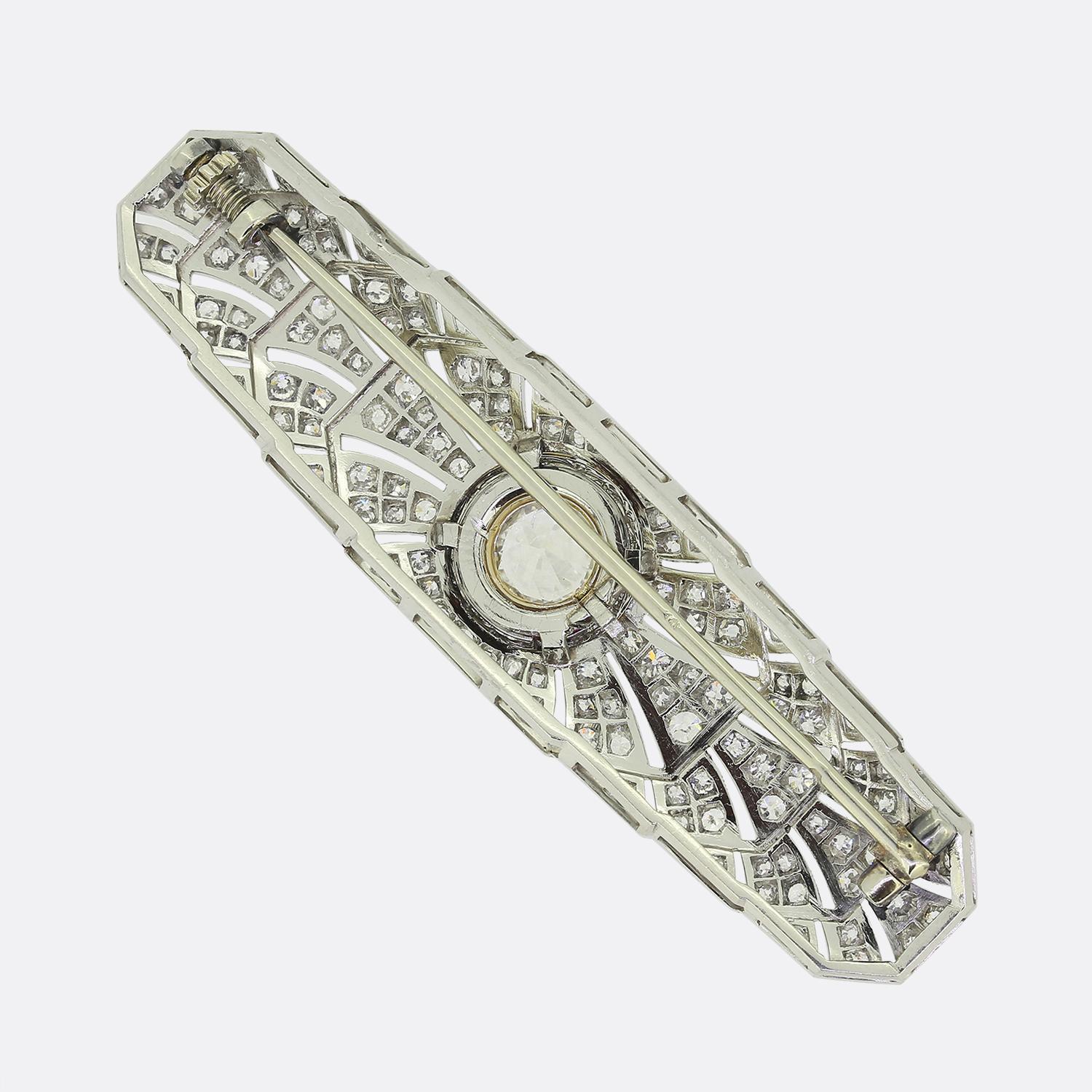 Here we have a gorgeous brooch from Raymond Templier crafted during the height of the Art Deco movement. This 18ct white gold piece has been beautifully decorated with a vast array of round faceted old cut diamonds highlighted by intricate milgrain