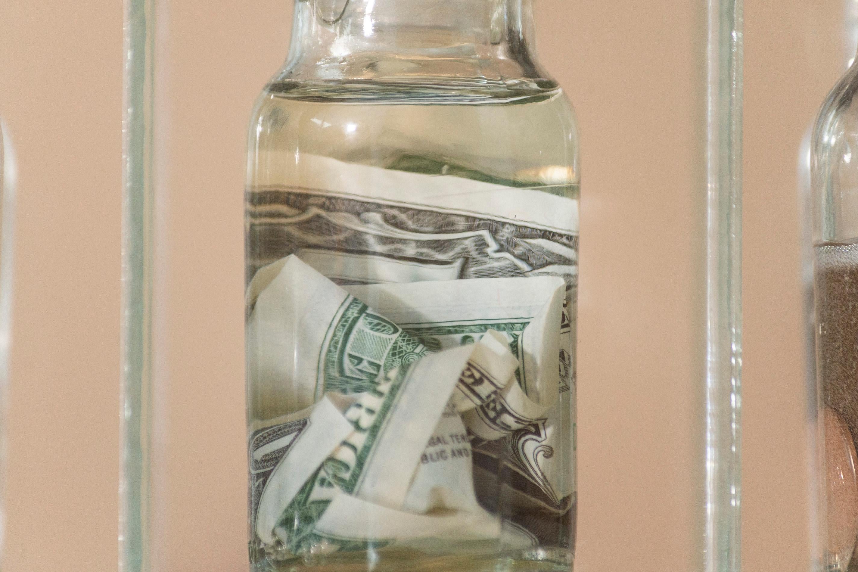 Stimulus Package - cabinet, bottles, money, mixed media, wall sculpture For Sale 1