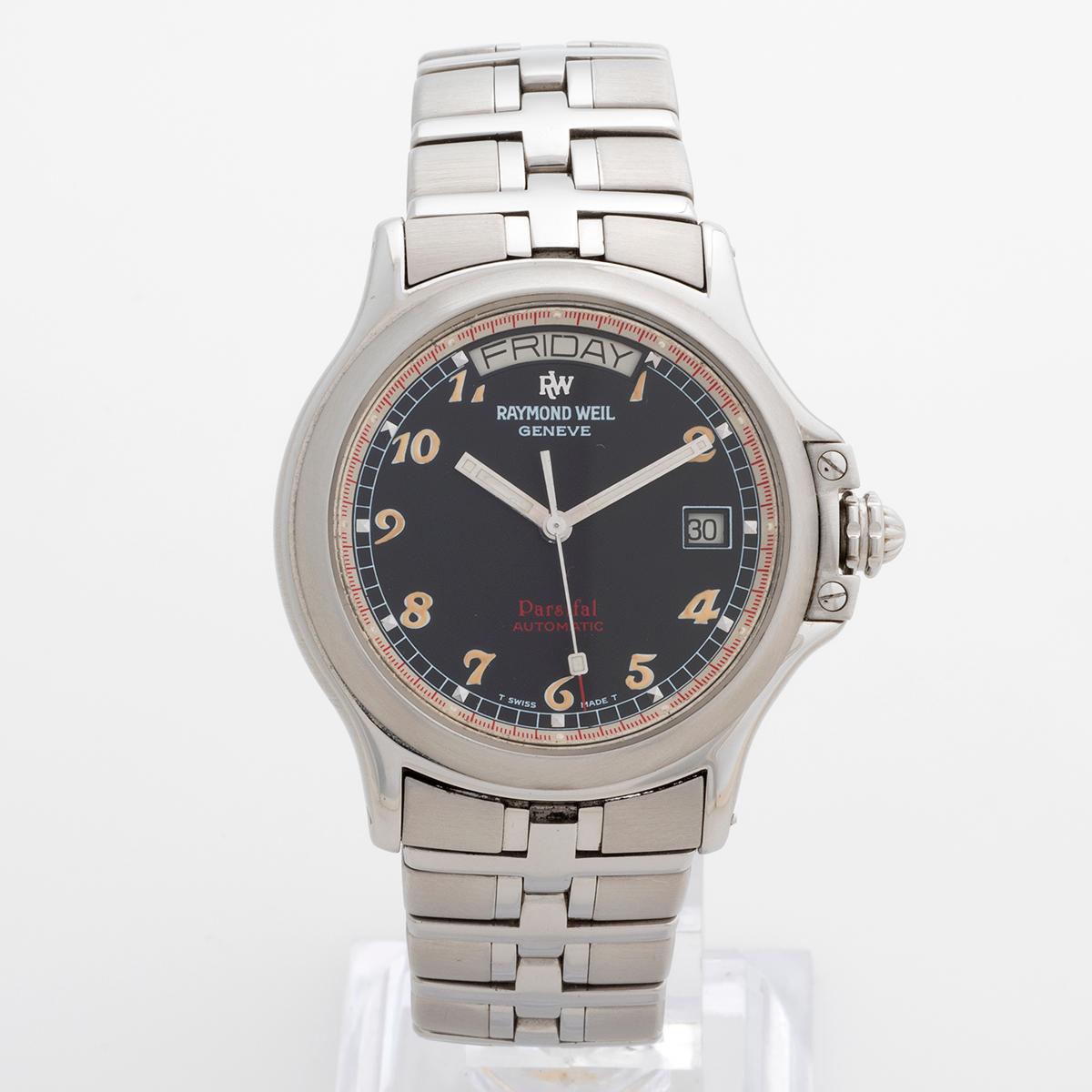 Our extremely rare Raymond Weil reference is an early example of the Parsifal range and is a range topping Day-Date automatic with jumbo stainless steel case (42mm x 42mm inc crown, 39mm exc crown) and stainless steel case. Of note is the dial, with