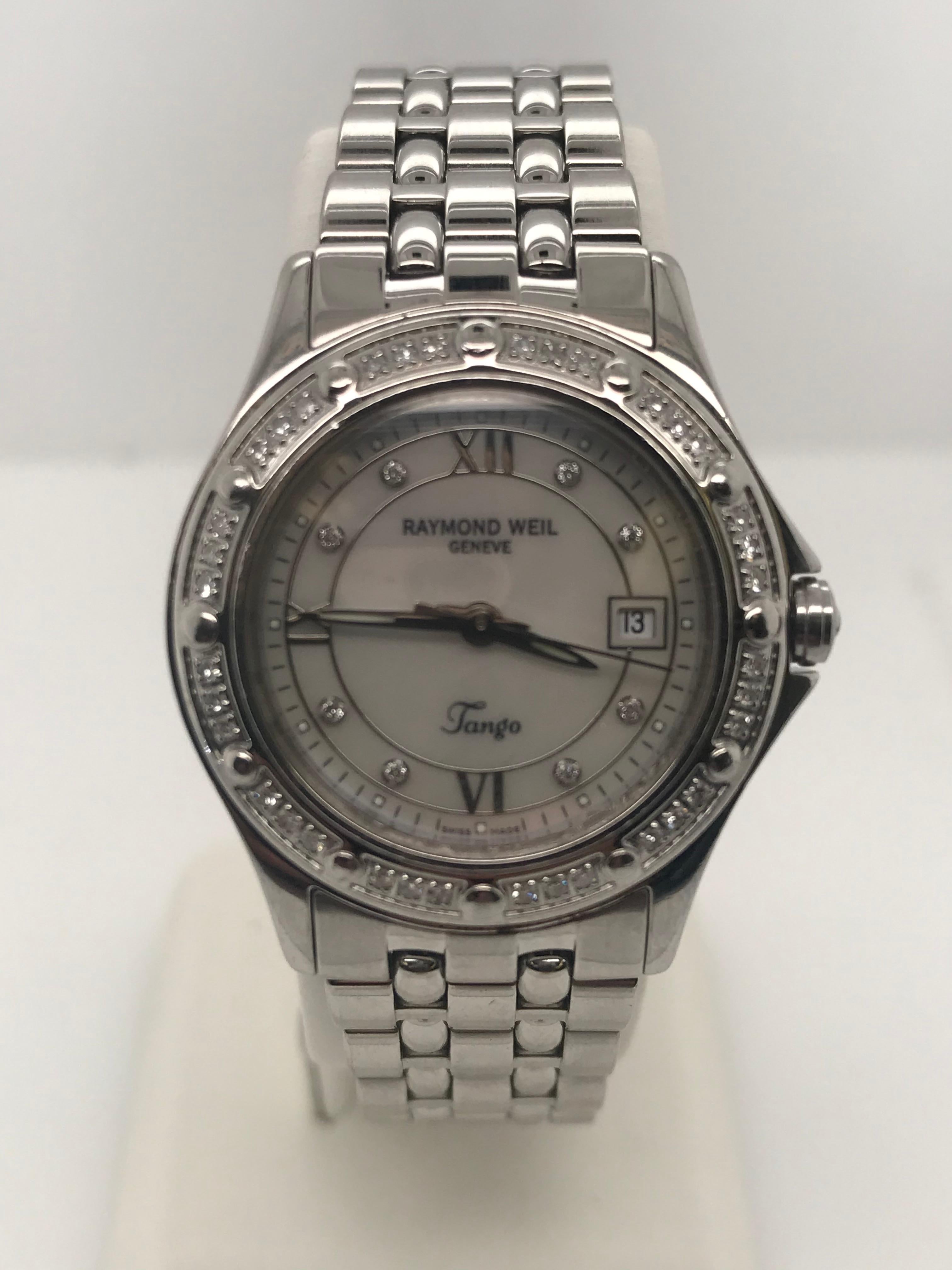 Lady's stainless steel Raymond Weil Tango model #5390, serial #V725402. The 44 diamonds in the bezel and markers have a total of .48cts.  The 28mm case has a sapphire crystal and mother of pearl dial and is secured by a fold over clasp.