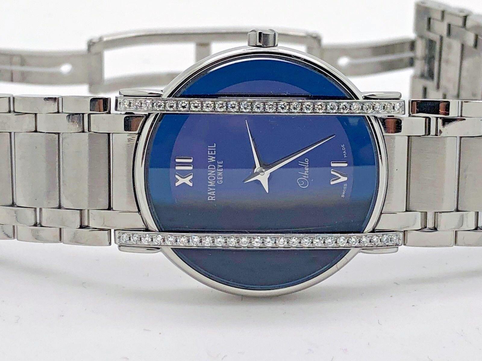 Raymond Weill Glass Sapphire and Diamond ladies watch 
A very sophisticated and classic style, this watch is part of the Othello collection with a deep blue dial with silver tone metal hands and Roman numerals. Gift box included, Swiss made.

Case