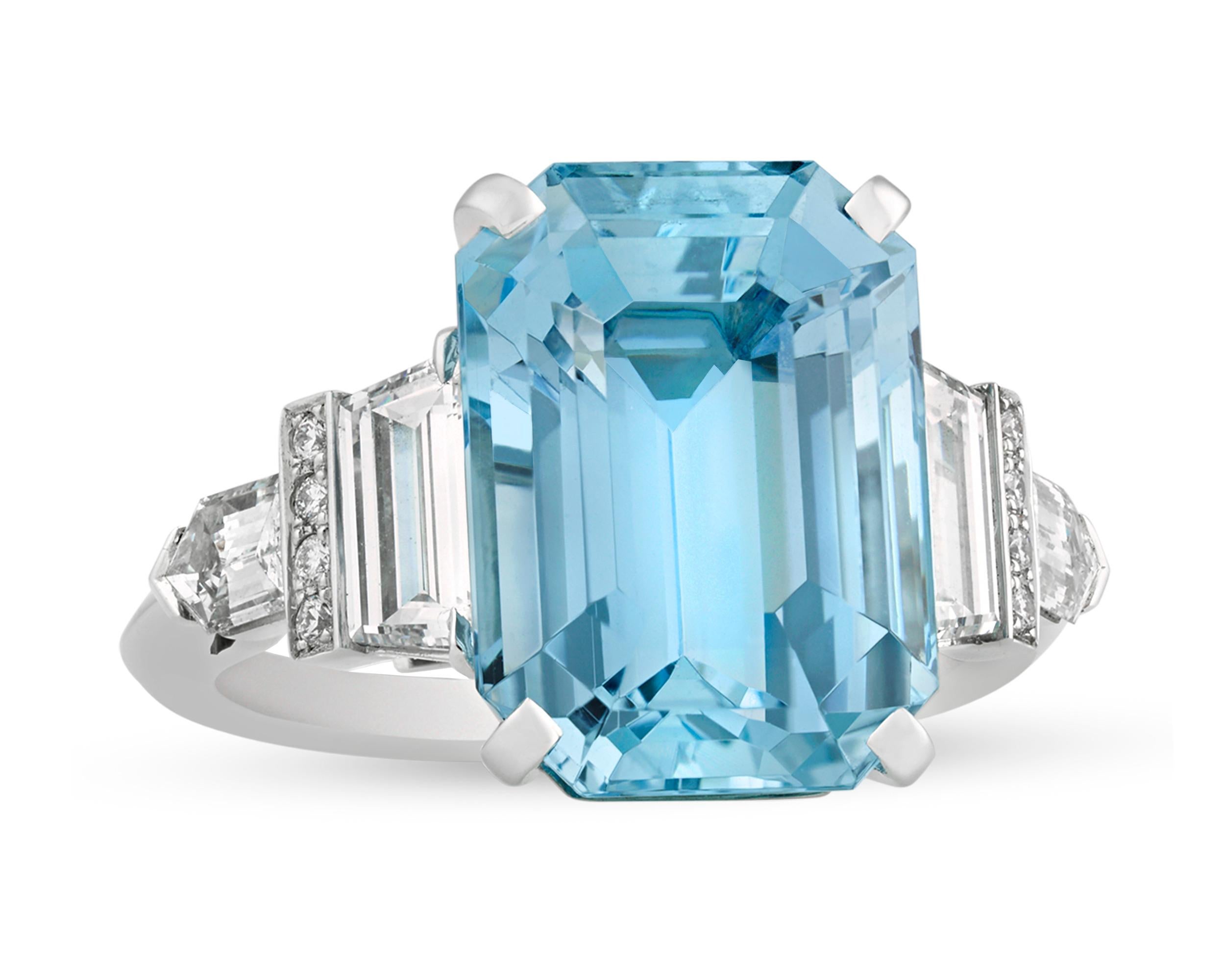 American jeweler and designer Raymond Yard created this spectacular cocktail ring centered by a vibrant 7.94-carat emerald-cut aquamarine. This enchanting aquamarine displays the refreshing, crisp blue color for which these stones are so coveted.