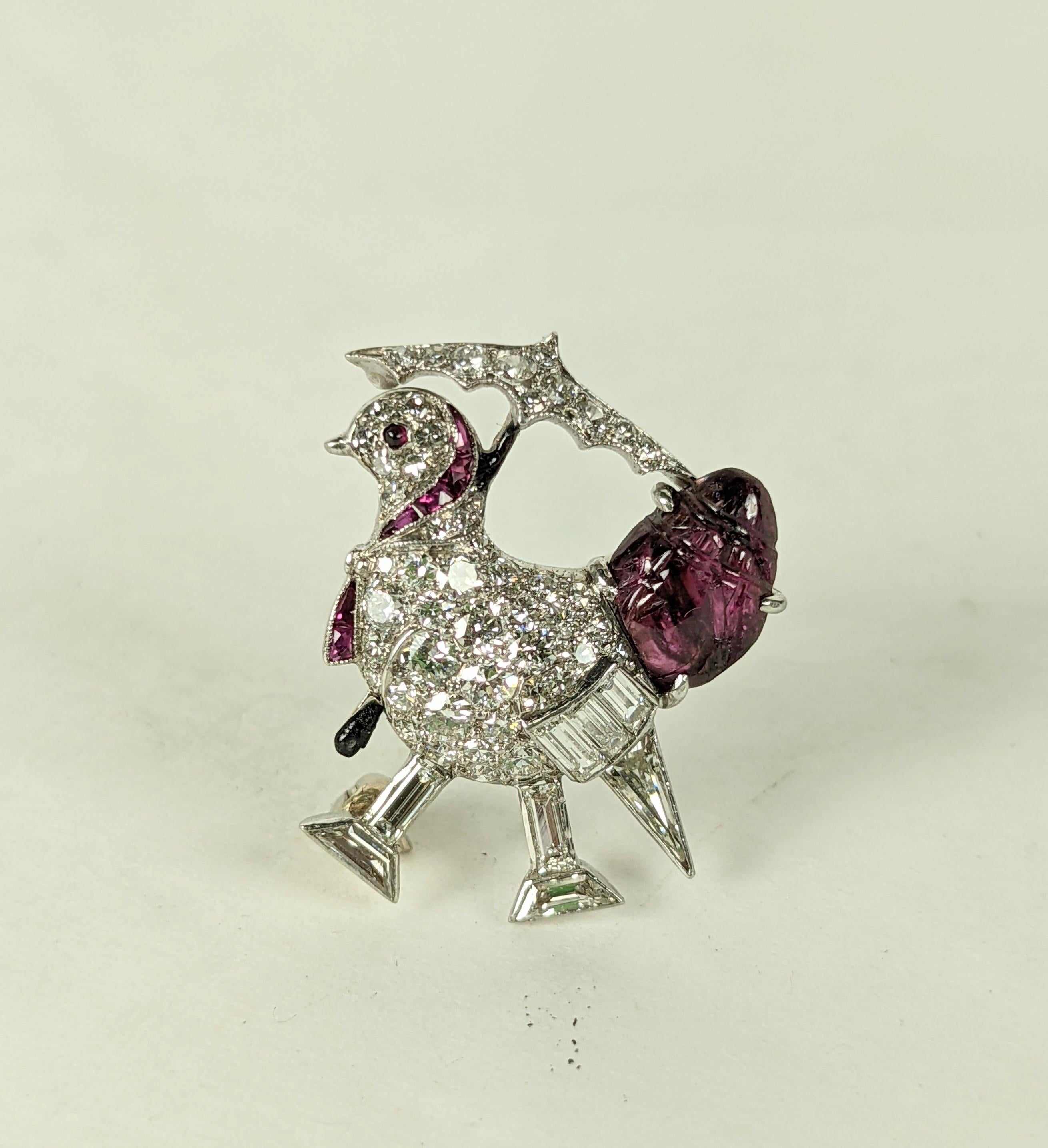 Rare, collectible Raymond Yard Cartoon Chickadee with parasol and ruby fruit salad tail. Diamonds in various cuts are used to render this charming Art Deco bird in platinum. Calibre rubies are used to detail the piece. 5/8