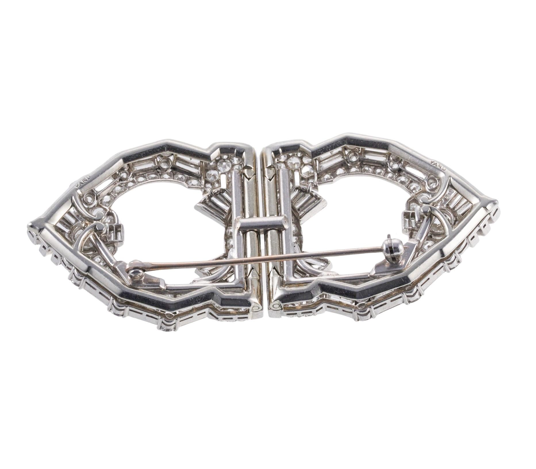 Art Deco platinum brooch by Raymond Yard, convertible into two clips. Adorned with approximately 12 carats in GH/VS-Si diamonds. Brooch measures 2.75
