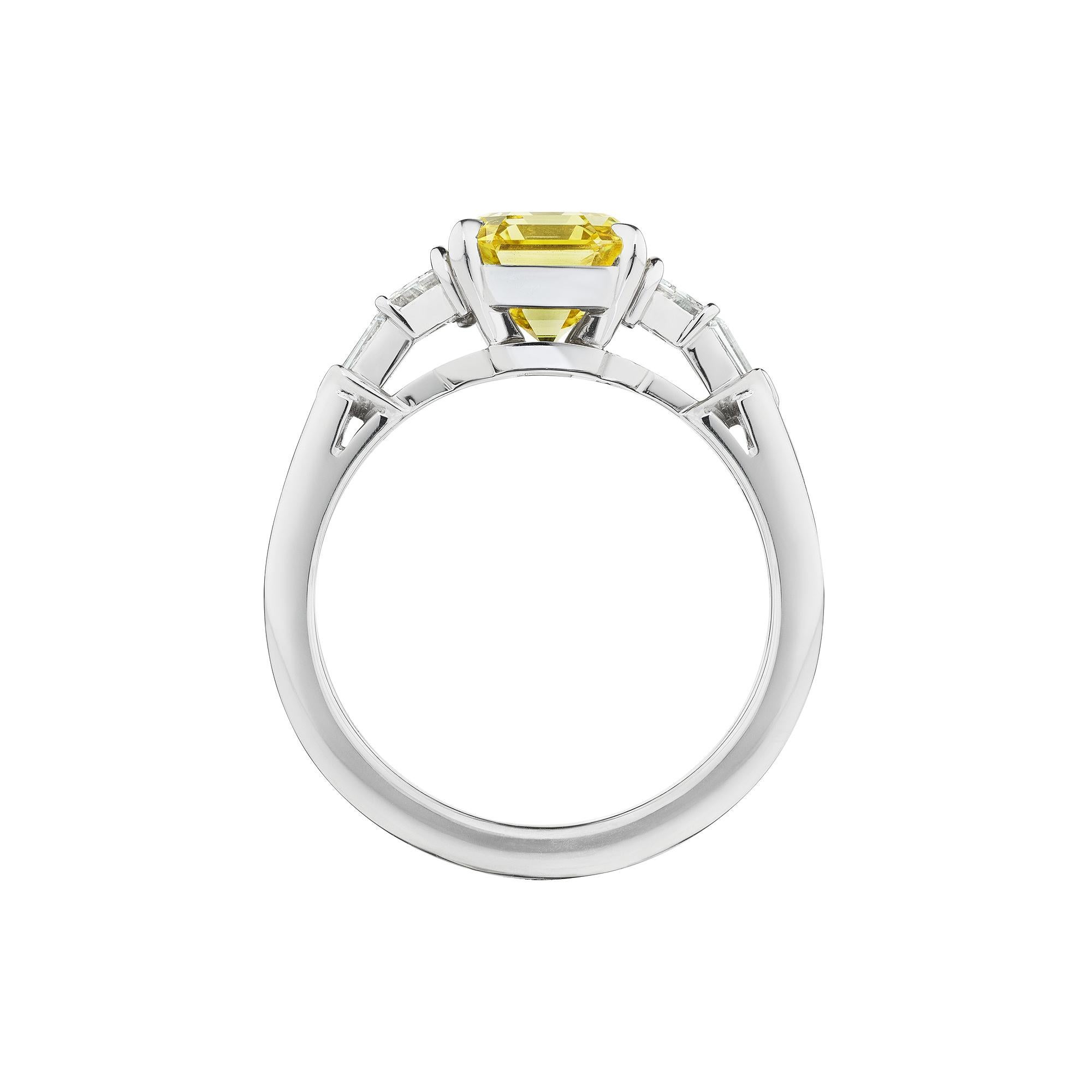 It is said that a sunny disposition is worth a fortune, and this yellow Raymond Yard design diamond ring is priceless.  With a sunlit center 2.02 carat emerald cut fancy intense natural yellow diamond, this handmade platinum ring is as naturally