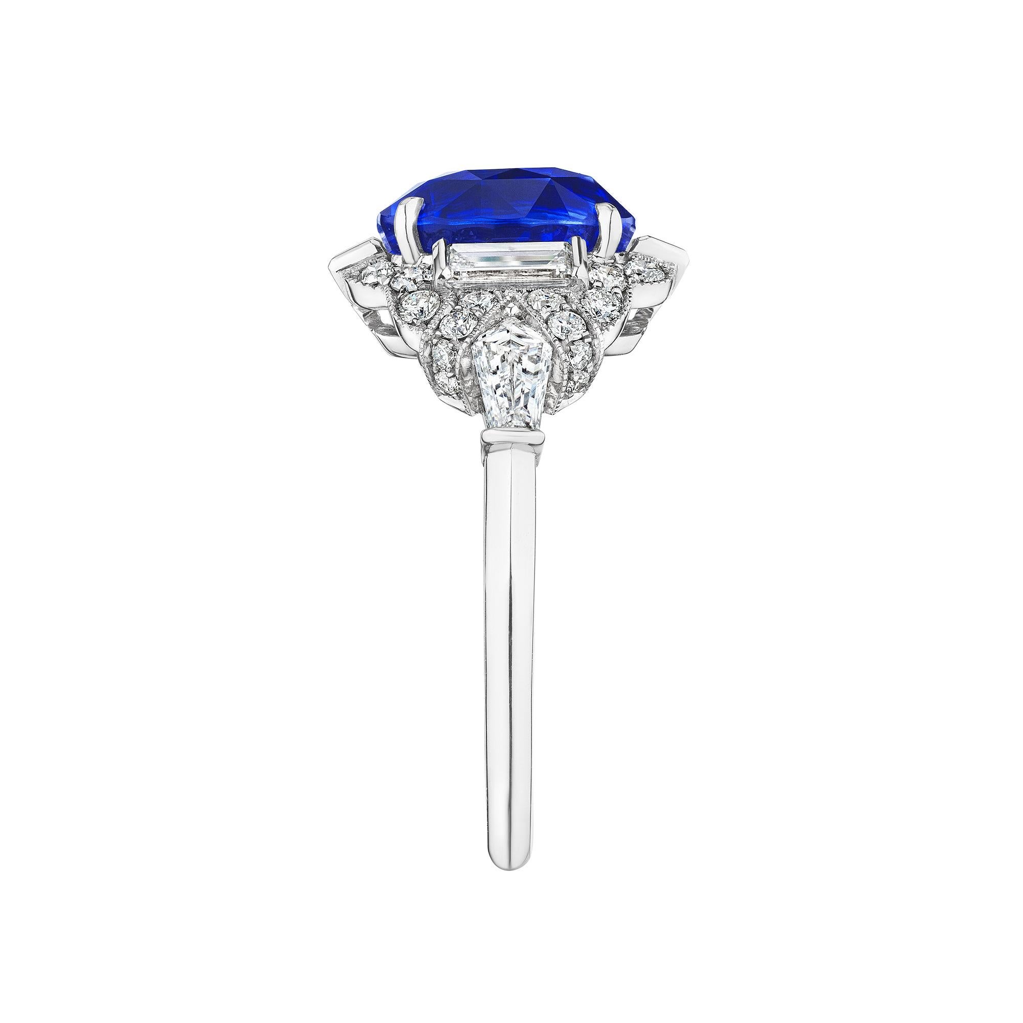 Looking as though it was plucked from a page of the Great Gatsby, this Art Deco style Raymond Yard natural (no heat) sapphire and diamond ring is pure elegance.  The center 3.53 oval cut sapphire is gracefully surrounded by two reverse