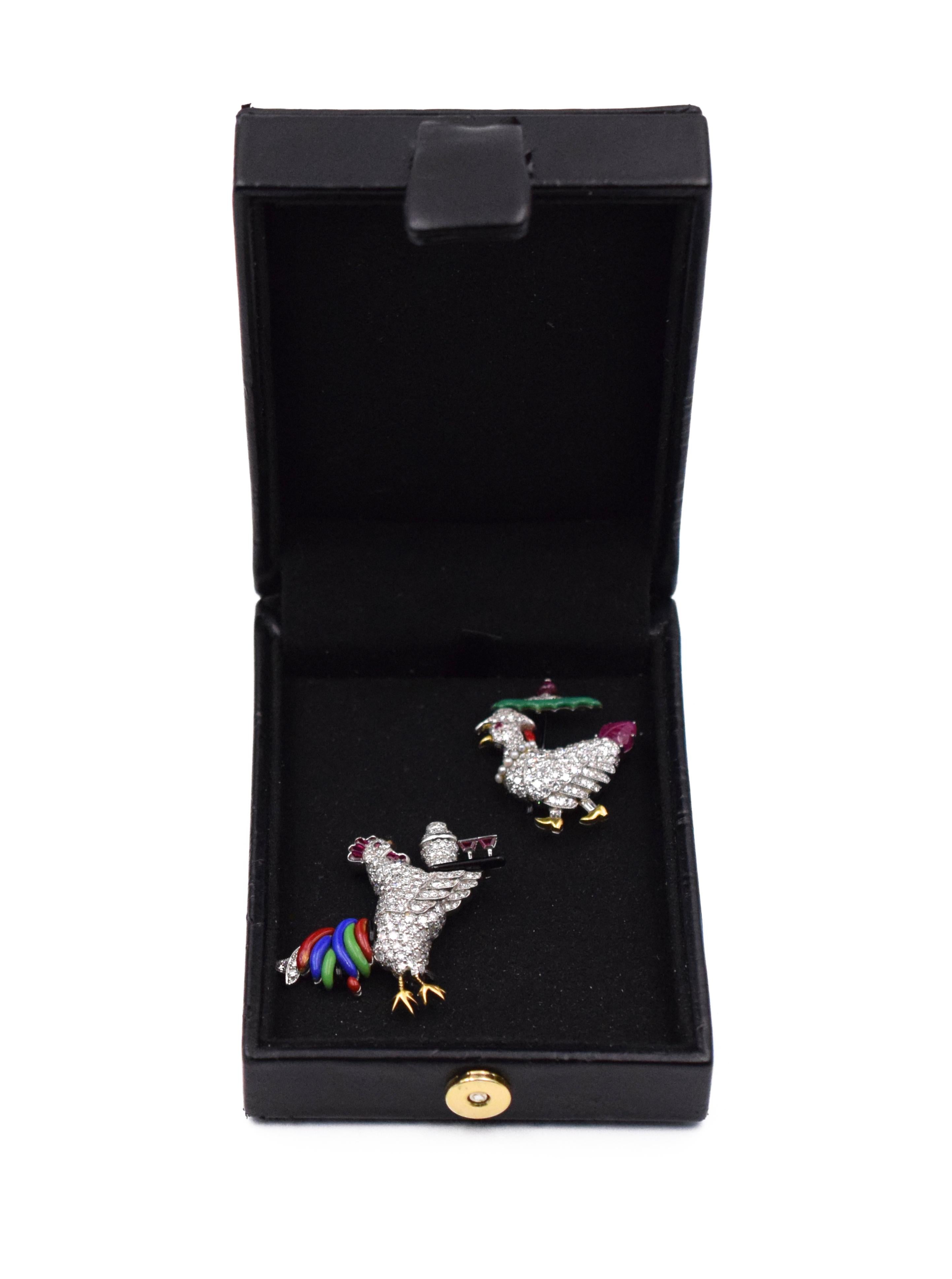 Ruby and Enamel Rooster Pin, Raymond Yard The rooster fashioned as a stylized cocktail waiter pavé-set with single- cut diamonds, holding a black enamel tray with shaker and martini glasses, signed Yard. Measurements: 1 1/2 inches and 1 1/2