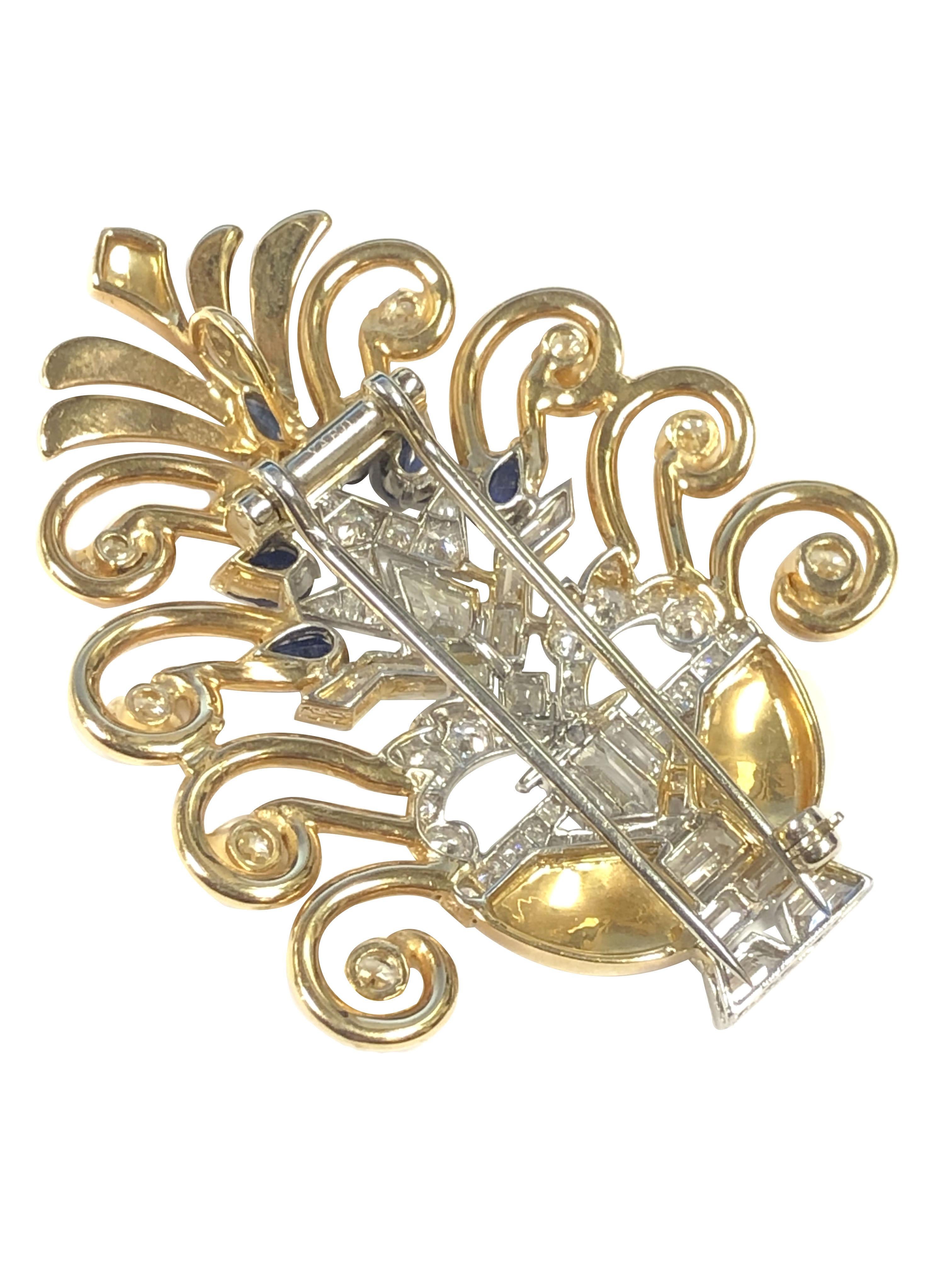Circa 1930s Raymond Yard Platinum and 14K Yellow Gold Brooch in a very High Art Deco style of a Planter, measuring 2 1/8 inches in length X 1 3/4 inches, set with Round, Baguette, Kite and French cut Diamonds totaling 2 Carats and further set with
