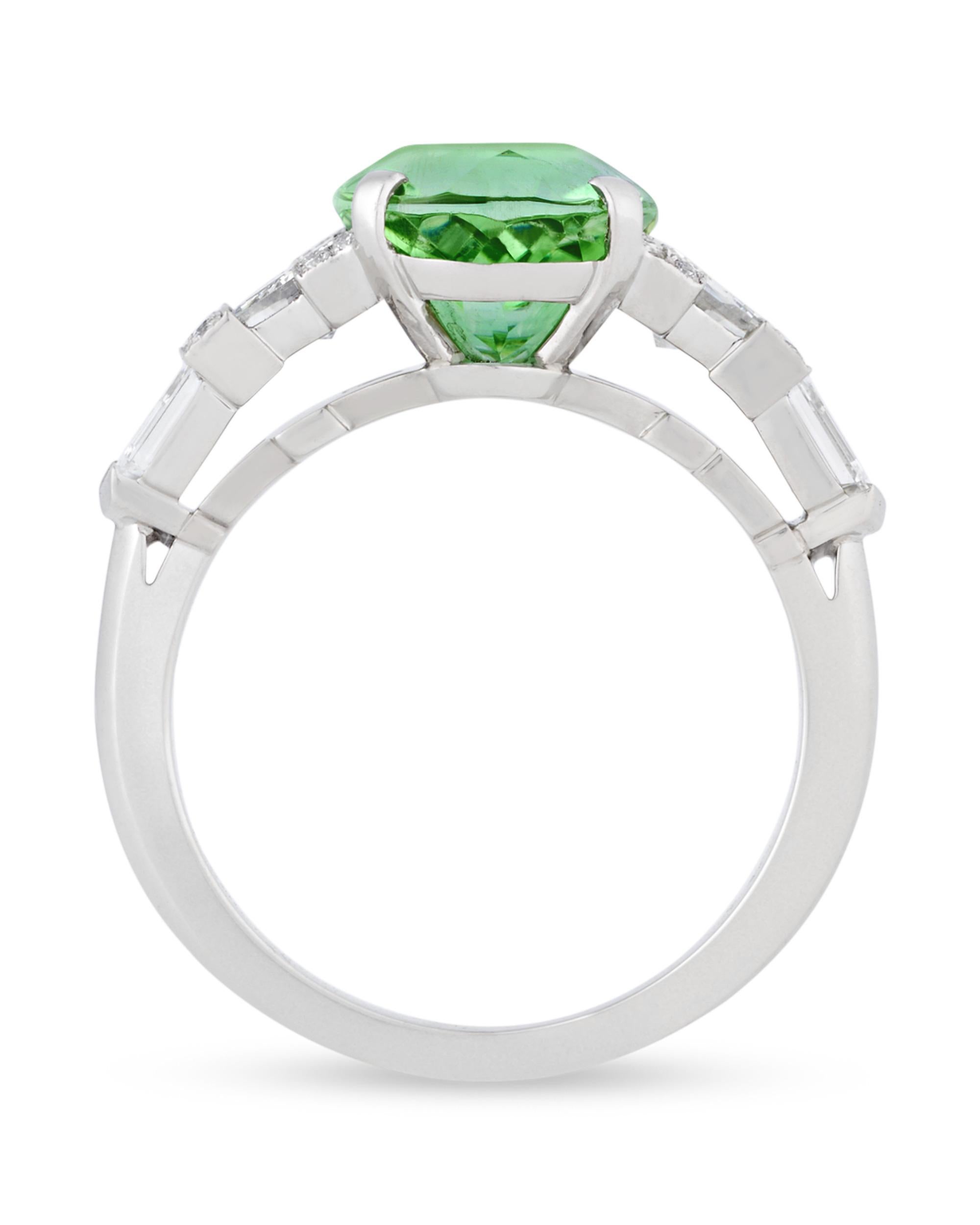 A luminous green 3.65-carat Paraiba tourmaline centers this elegant ring from famed jeweler Raymond Yard. First discovered in 1989, the Paraiba tourmaline is one of the world’s rarest and most vibrant gemstones. It is thanks to their rare chemical