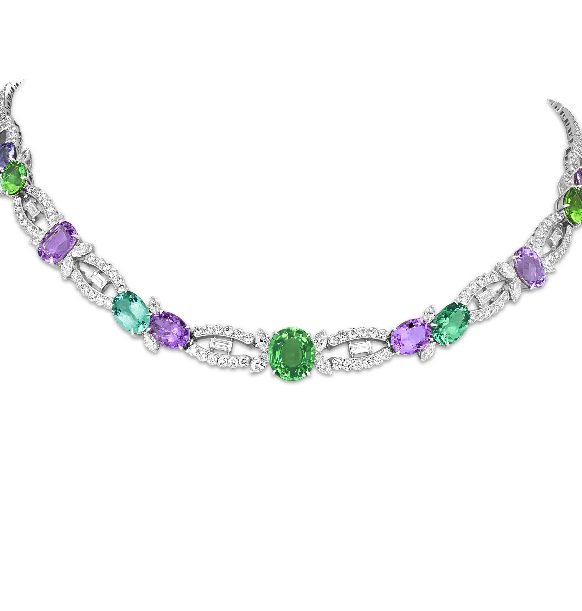 This stunning multicolor Paraiba tourmaline necklace from beloved American jeweler Raymond Yard features 11 of the storied gems in varying hues of blue, purple and green. Totaling 26.08 carats, the Paraibas are certified by the Swiss Gemmological
