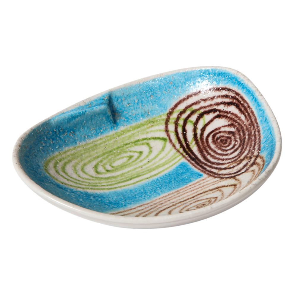 Alvino Bagni for Raymor bowl, ceramic, blue, green, abstract spirals, signed. Medium scale ceramic bowl or ashtray decorated with sky blue, light brown, dark brown, and light green spiral graphics. Signed: 
