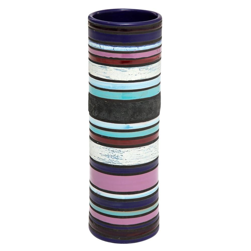 Bitossi for Raymor Cambogia (Cambodia) vase, ceramic, blue, purple, white, stripes, signed. Tall cylinder vase with banded stripes glazed in violet, indigo blue, cyan blue, white, and a dark coarse black. Retains original Raymor label, which reads: