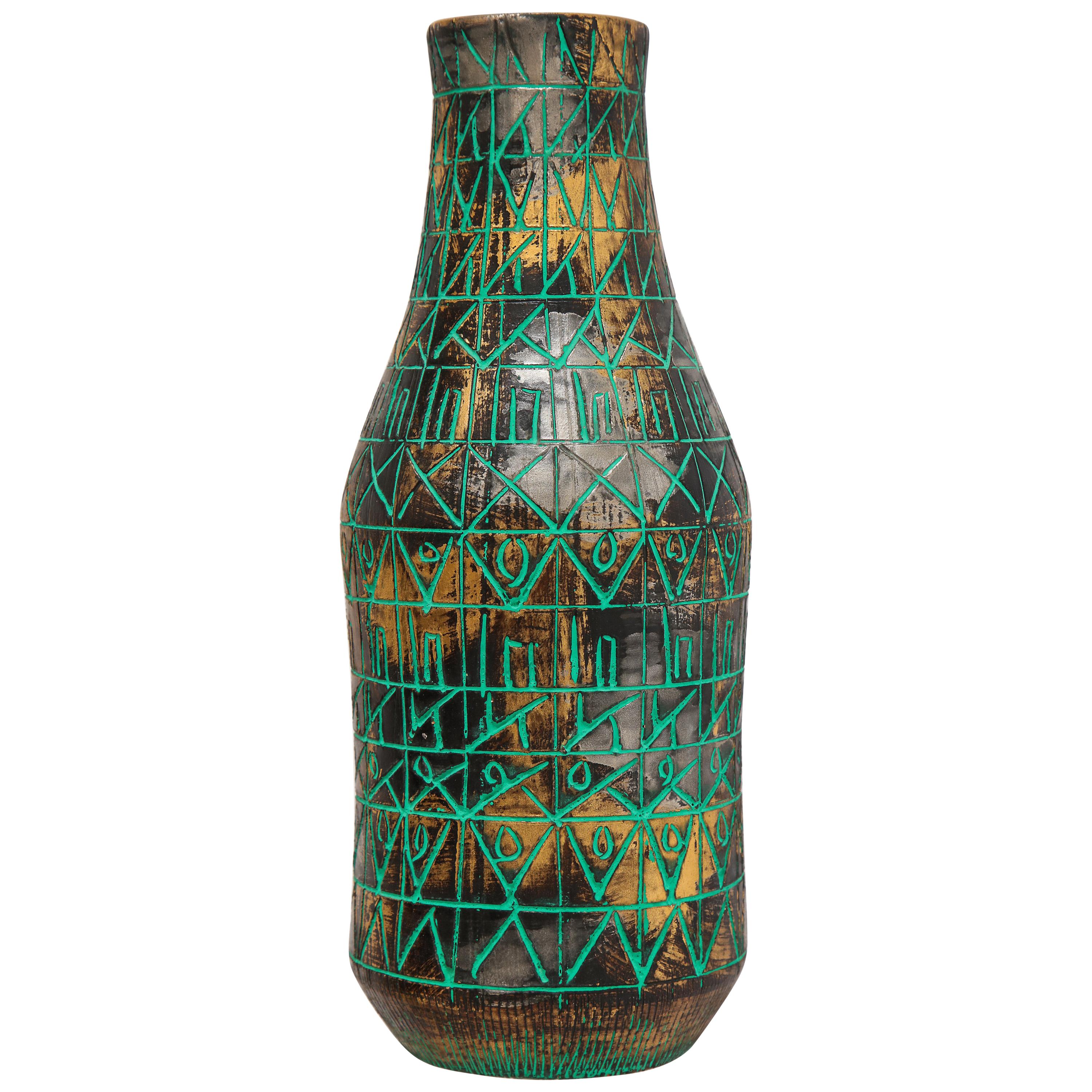 Raymor vase, ceramic, sgraffito, green, gold, chrome, signed. Medium scale bottle form vase decorated with an incised green pattern over gold and dark chrome glazed body. Signed on underside: Raymor, Italy 112. Retains a remnant of a Raymor paper