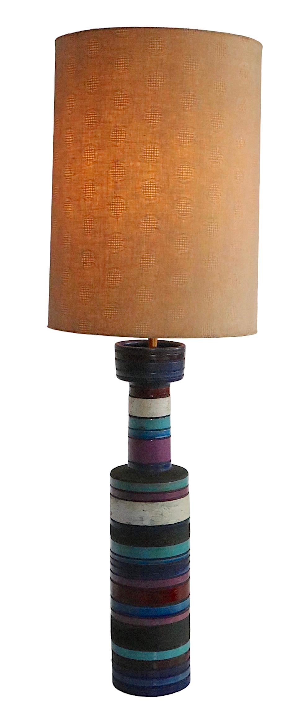 Rare Aldo Londi designed Cambogia table lamp made in Italy by Bitossi, imported by Raymor, circa 1950s. The ceramic body features poly chrome stripes with alternating high glaze and dark volcanic textured bands. The lamp is in very good, original,