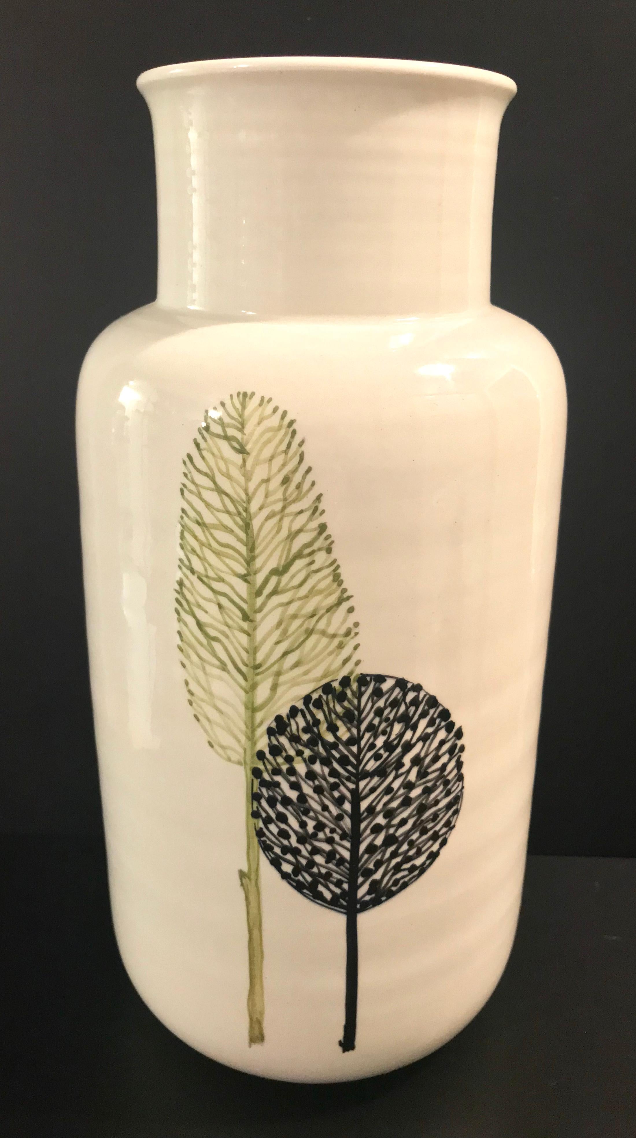 White ceramic Raymor vase with leaf design.