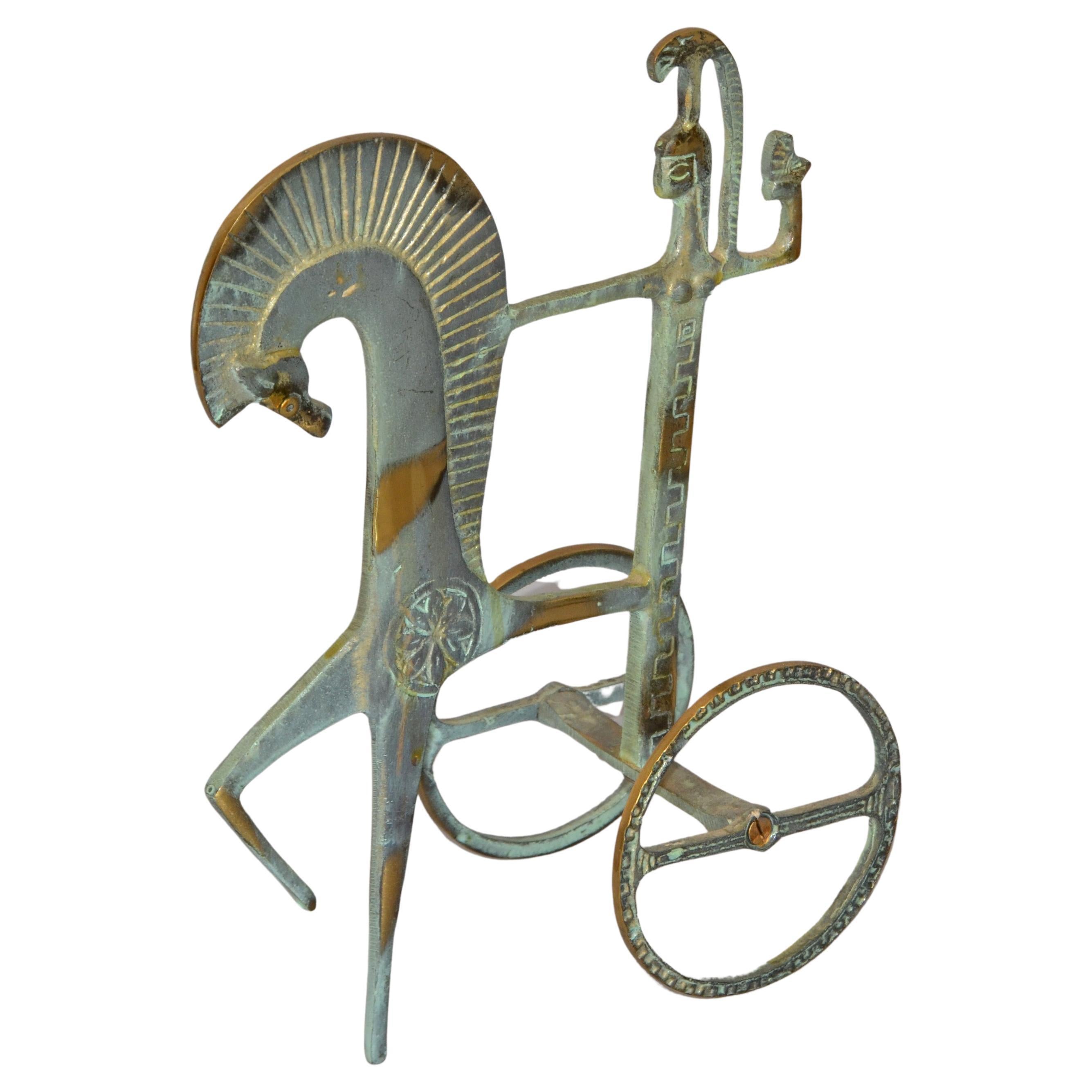 This is a bronze sculpture, which may have been done by Frederic Weinberg for Raymor.
It is an incredibly stylized Roman Chariot and has a patina finish. Italian-made and great for any Mid-Century Modern interior.
It looks like the work of
