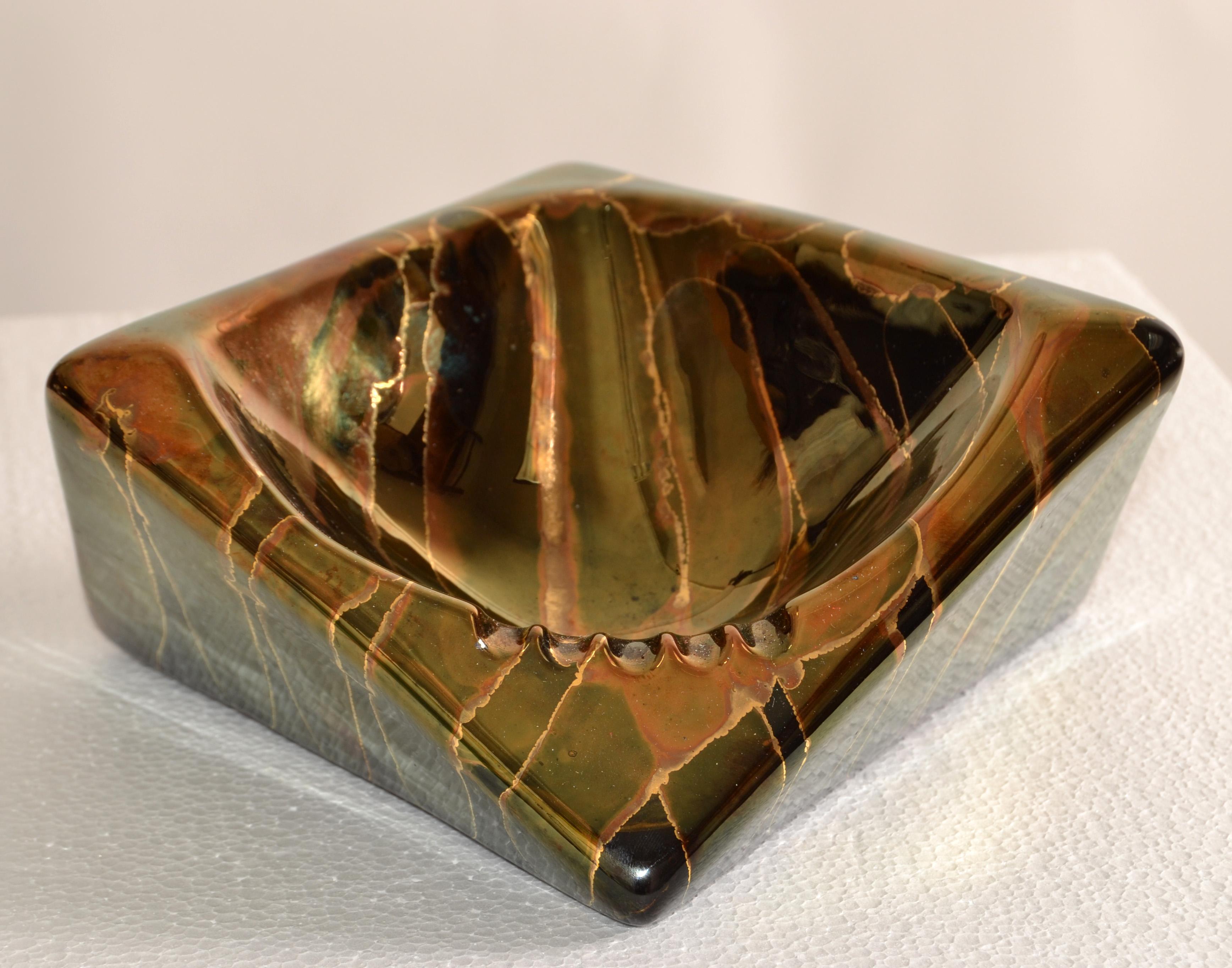 Vintage glazed black, bronze and gold Ceramic ashtray, vide poche, catchall attributed to Raymor Pottery, Italy. 
Handcrafted Pottery Ashtray and a highly decorative asymmetric design.
In good vintage condition, no chips or cracks.
 
 
