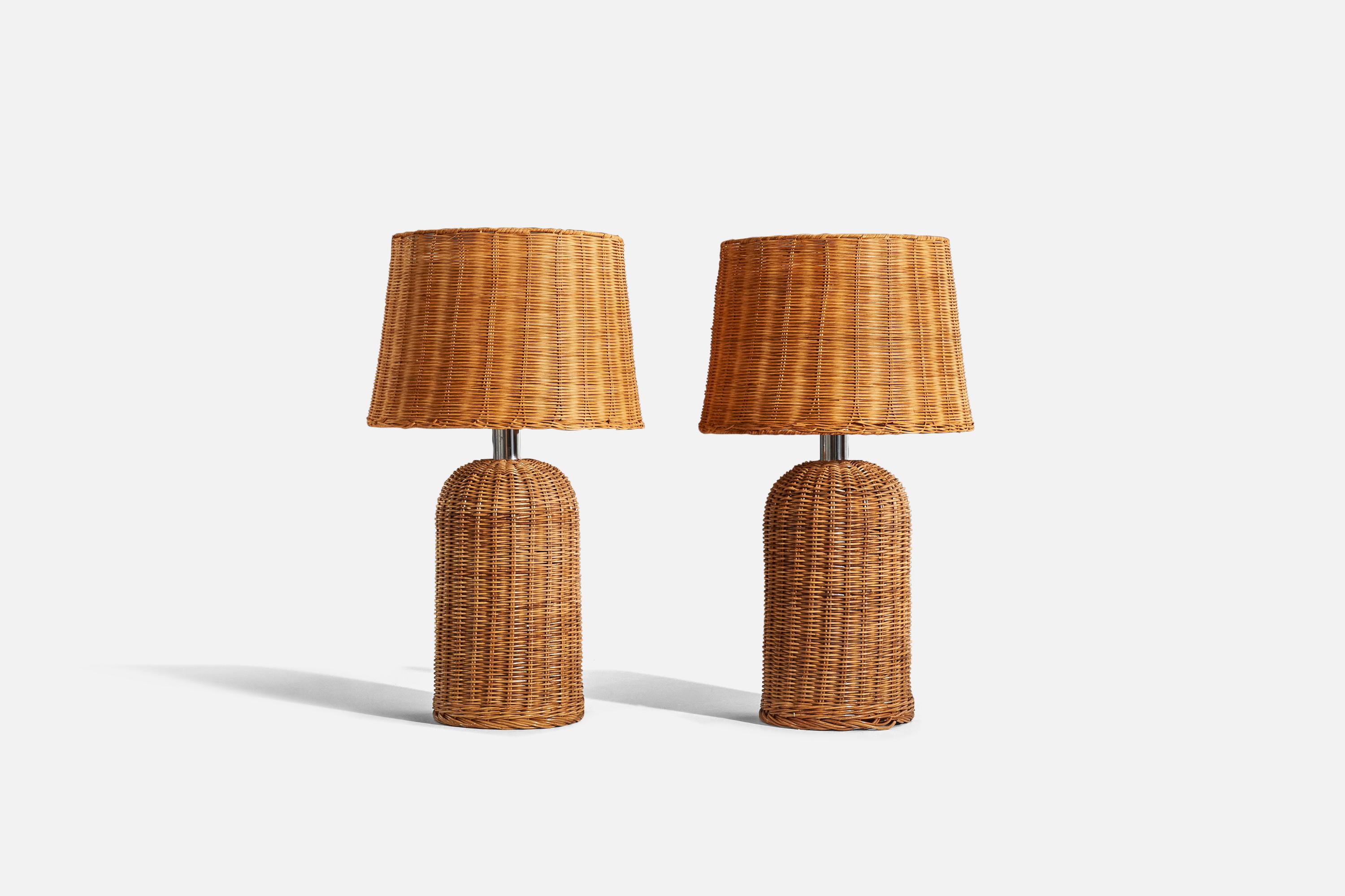 A pair of wicker table lamps designed and produced by Raymor, Italy, 1970s. 

Lampshades are replaced.

Sold with lampshades. 
Dimensions of Lamp (inches) : 22.56 x 9.25 x 9.25 (H x W x D)
Dimensions of Shade (inches) : 13.5 x 16.5 x 11.5 (T x