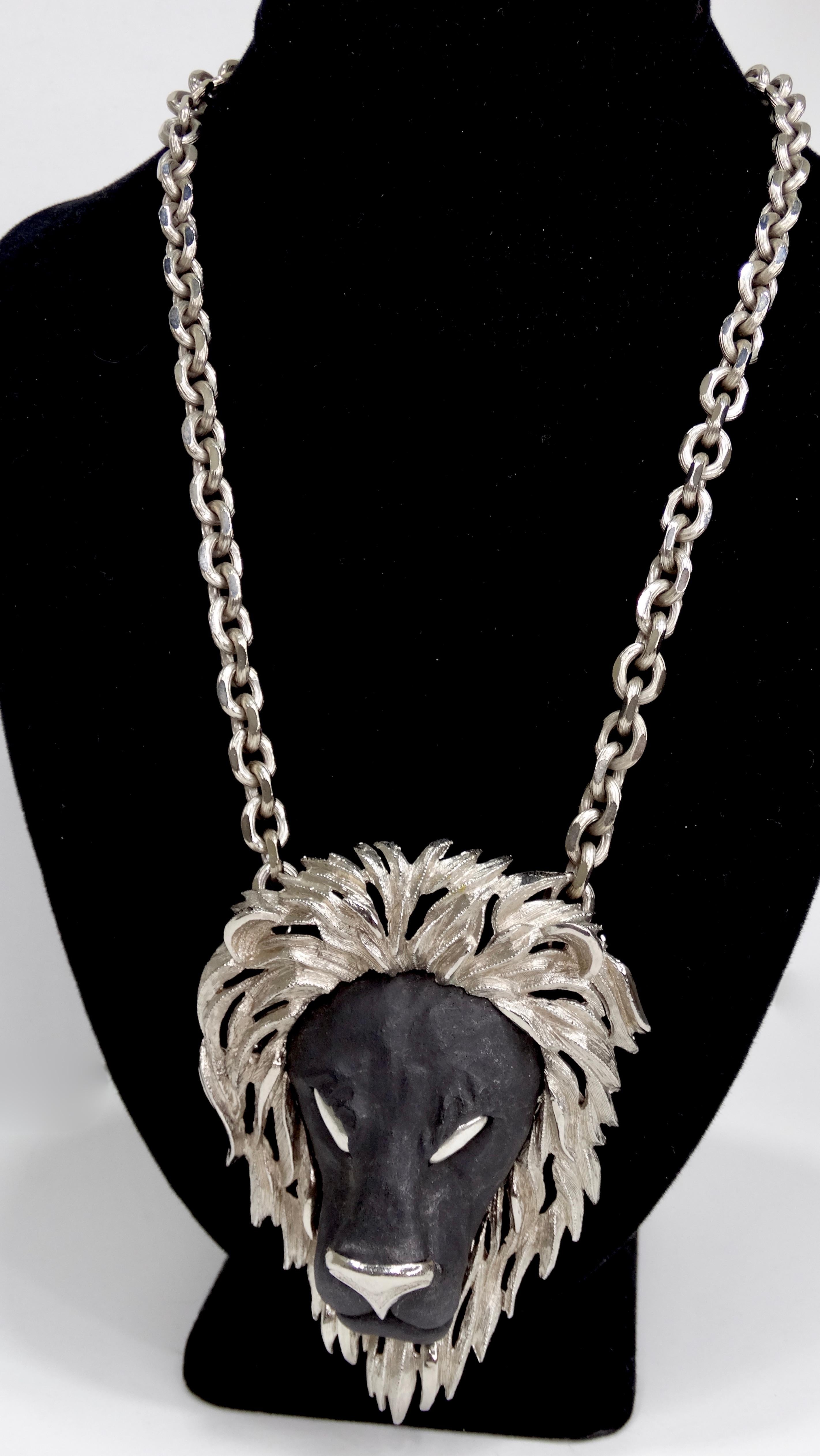 The perfect statement necklace! Circa 1970s, this Razza necklace features silver toned hardware and a large black resin lion pendant. Timeless and a true vintage piece, this necklace is perfect to pair with your favorite Oscar de la Renta kaftan or