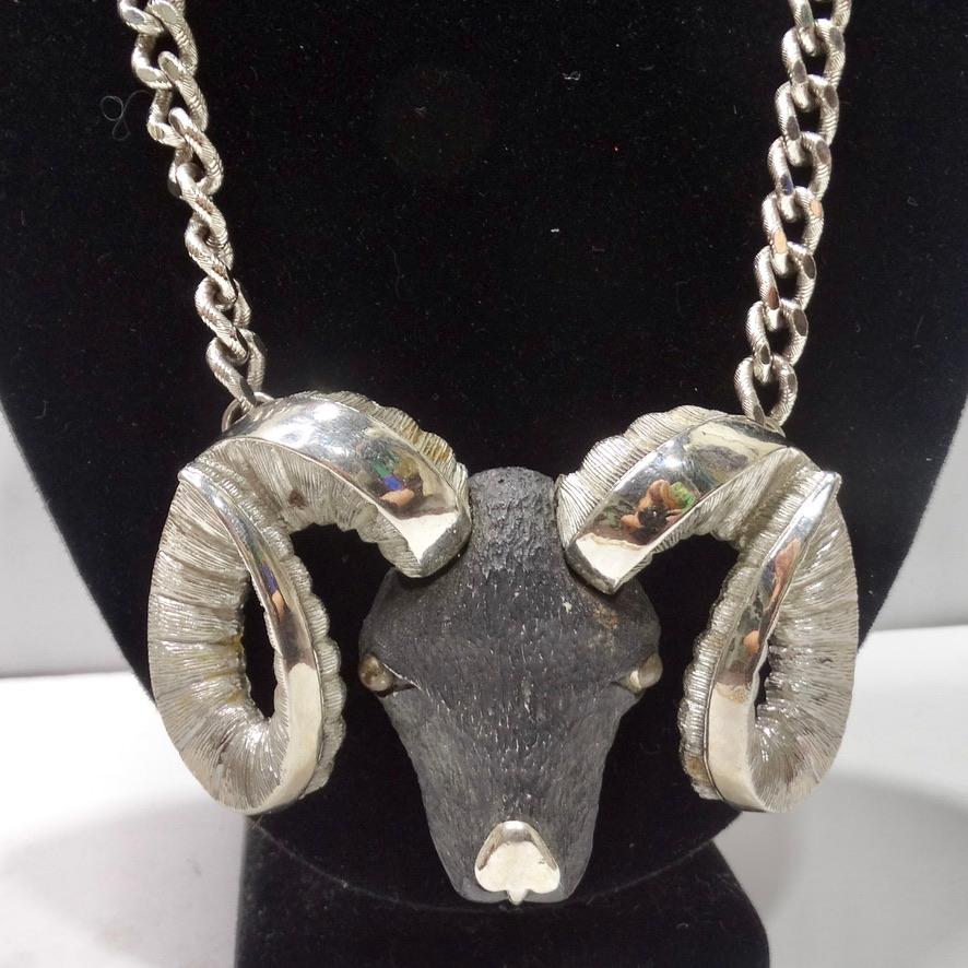 On the hunt for your next favorite statement necklace? Look no further as RAZZA has you covered with this incredible jumbo ram pendent necklace circa 1970s! A silver tone chain joins together a show stopping silver plated Aries ram pendent with