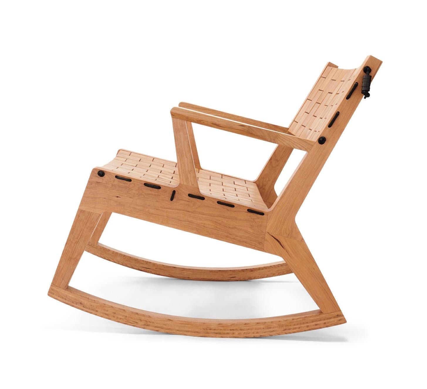 Woodsport RB rocking chair. Named after the running bond pattern in which bricks are laid. Individual pieces are laced together with high grade polyester rope, creating a soft surface that flexes with the occupant. The chair is detailed with burl