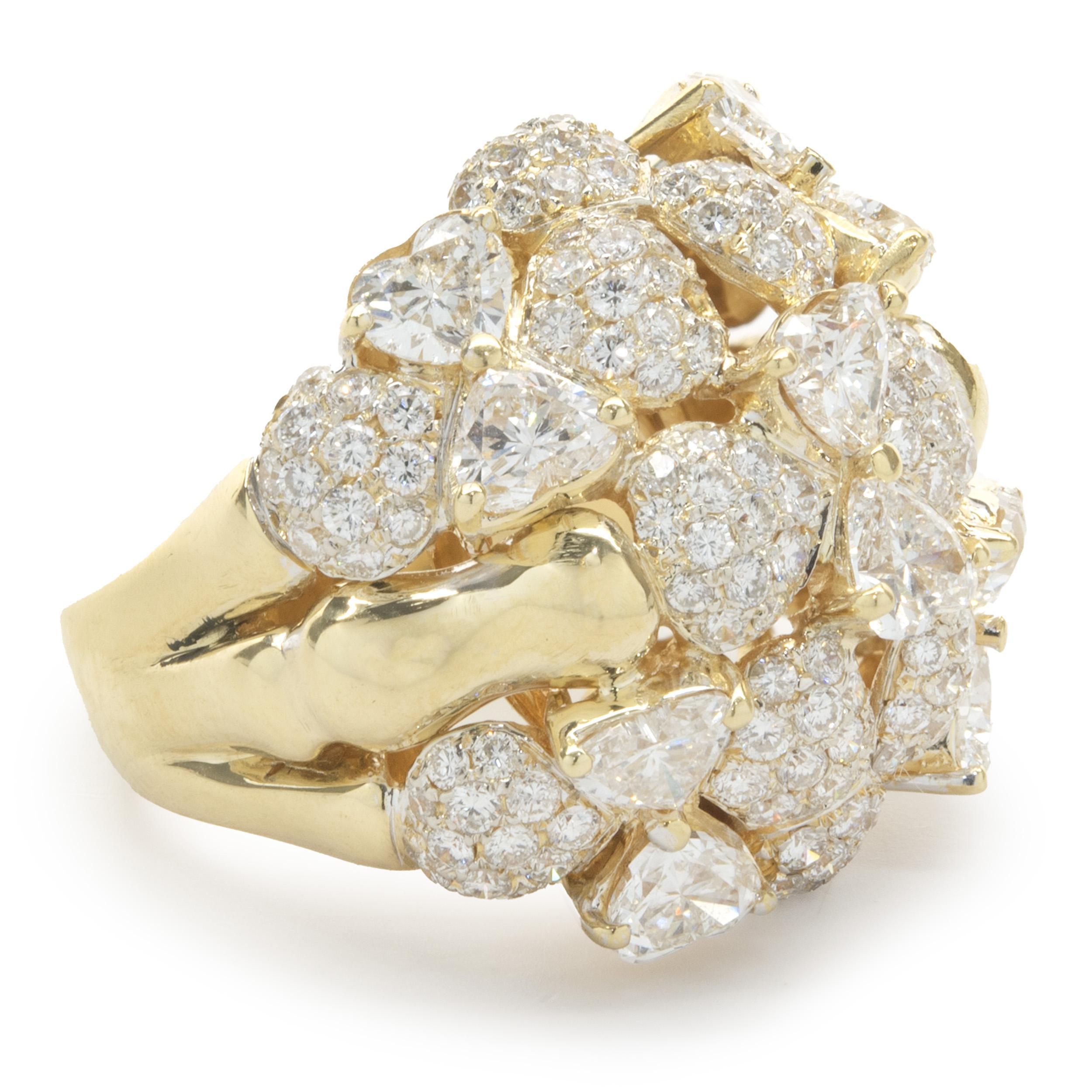 Designer: R.C.M
Material: 18K yellow gold
Diamonds: 156 round brilliant cut = 1.60cttw
Color: F
Clarity: VS2
Diamonds: 10 trillion cut = 2.40cttw
Color: F
Clarity: VS2
Dimensions: ring top measures 22mm wide
Size: 5.75 
Weight: 15.35 grams
