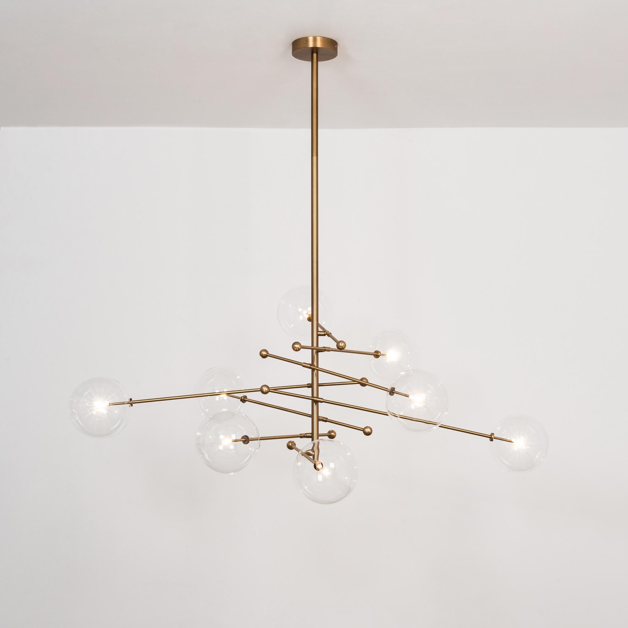RD15 8 Arms Chandelier by Schwung
Dimensions: W 200 x H 180
Materials: Solid brass, hand blown glass globes
Lamp: 8 x max 10W G4, 12V (bulbs included)

 
Schwung is a German word, and loosely defined, means energy or momentumm of a positive