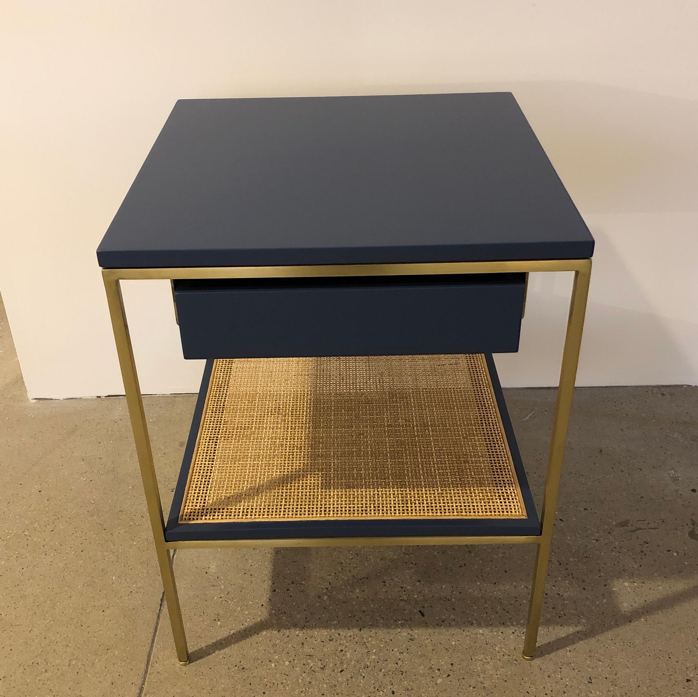 Versatile, Minimalist style bedside tables with lacquered components on satin brass frames. Available in custom colors for a 10% up-charge. Solid or caned shelf options.
