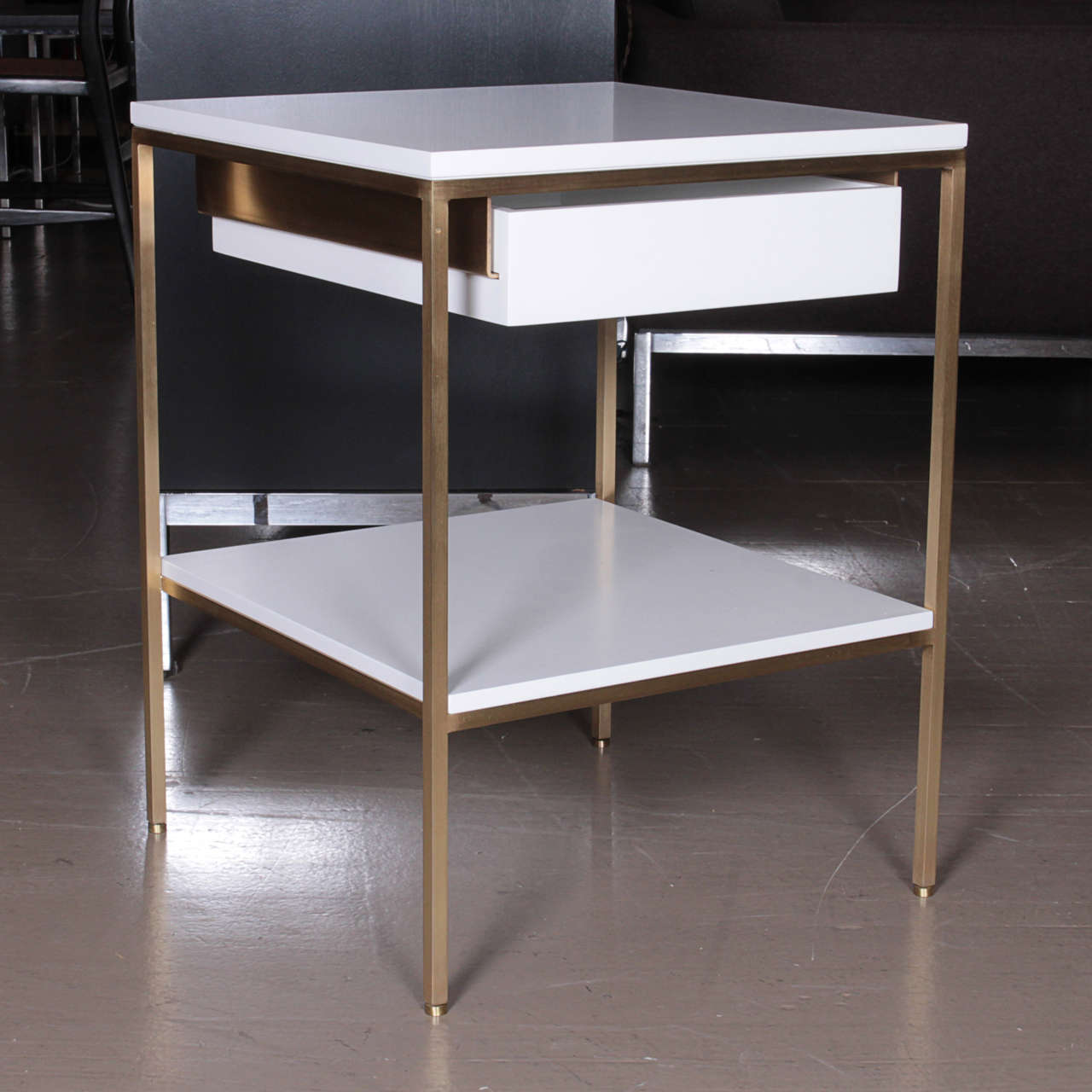 reGeneration satin lacquer and brass bedside tables shown here in our standard, BM soft chamois satin white lacquer. Metal finishes are solid brass, oiled bronze, stainless steel, or powder coat.