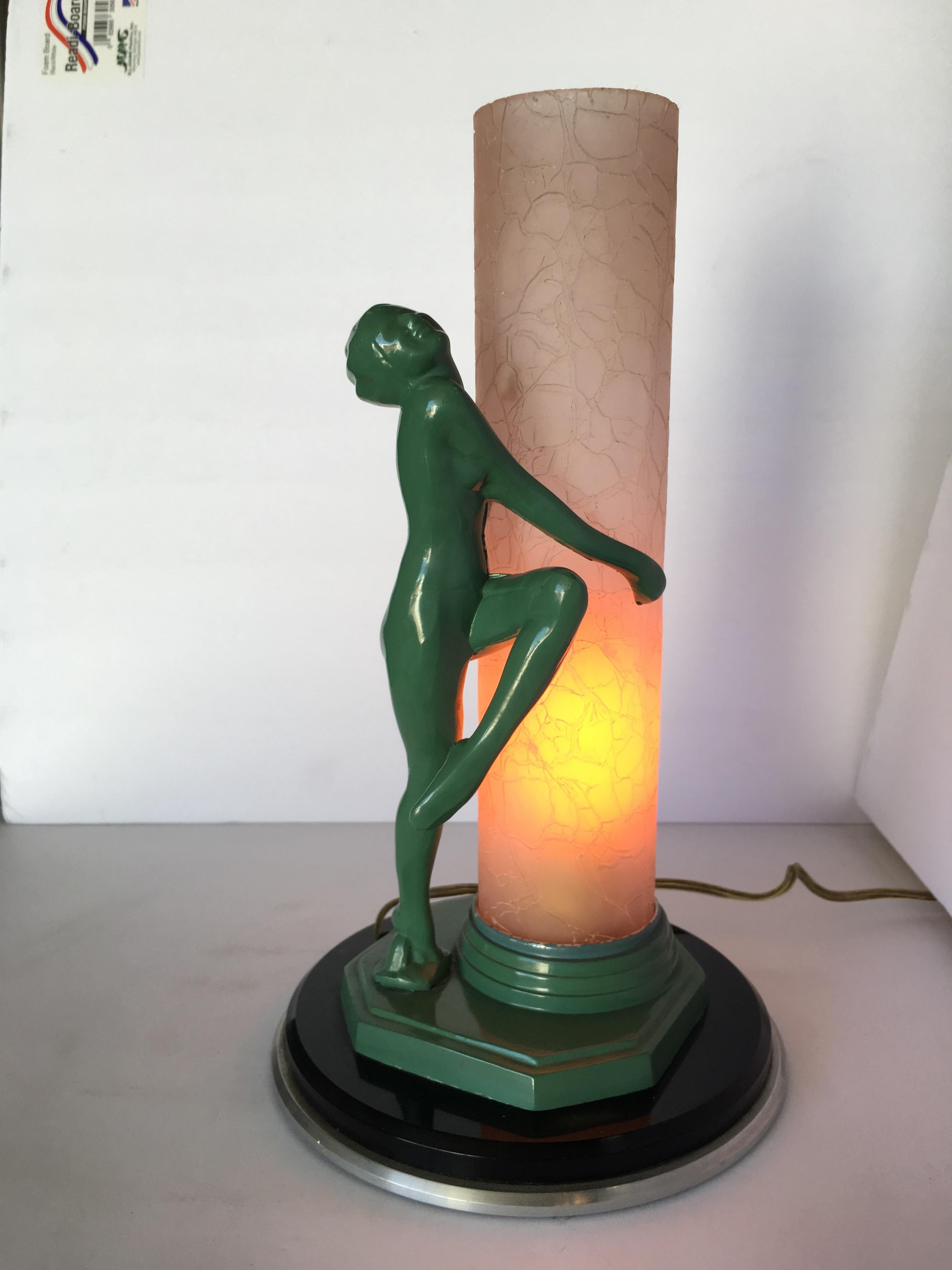 Re-edition of the Frankart F612 lamp with a pink glass shade featuring a nude flapper dancer.