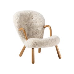 Riedizione della sedia lounge Clam di Arnold Madsen in pelle di pecora di Dagmar