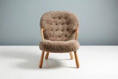 Re-Edition Sheepskin Clam Chair & Stool by Arnold Madsen