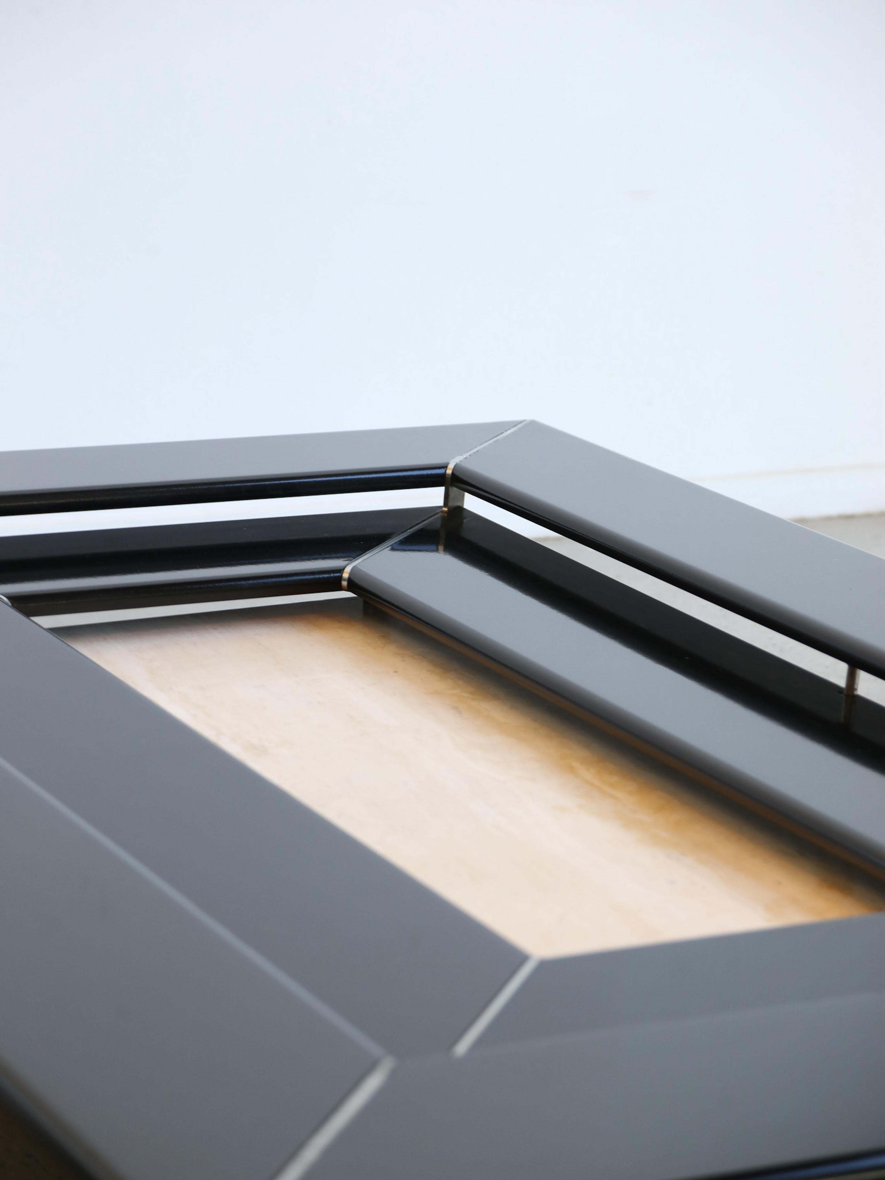 Designed by the renowned Italian architect and designer Paolo Piva, the Re Quadro coffee table is a true statement piece of contemporary design. This striking table features a bold geometric frame that combines sharp angles and clean lines,