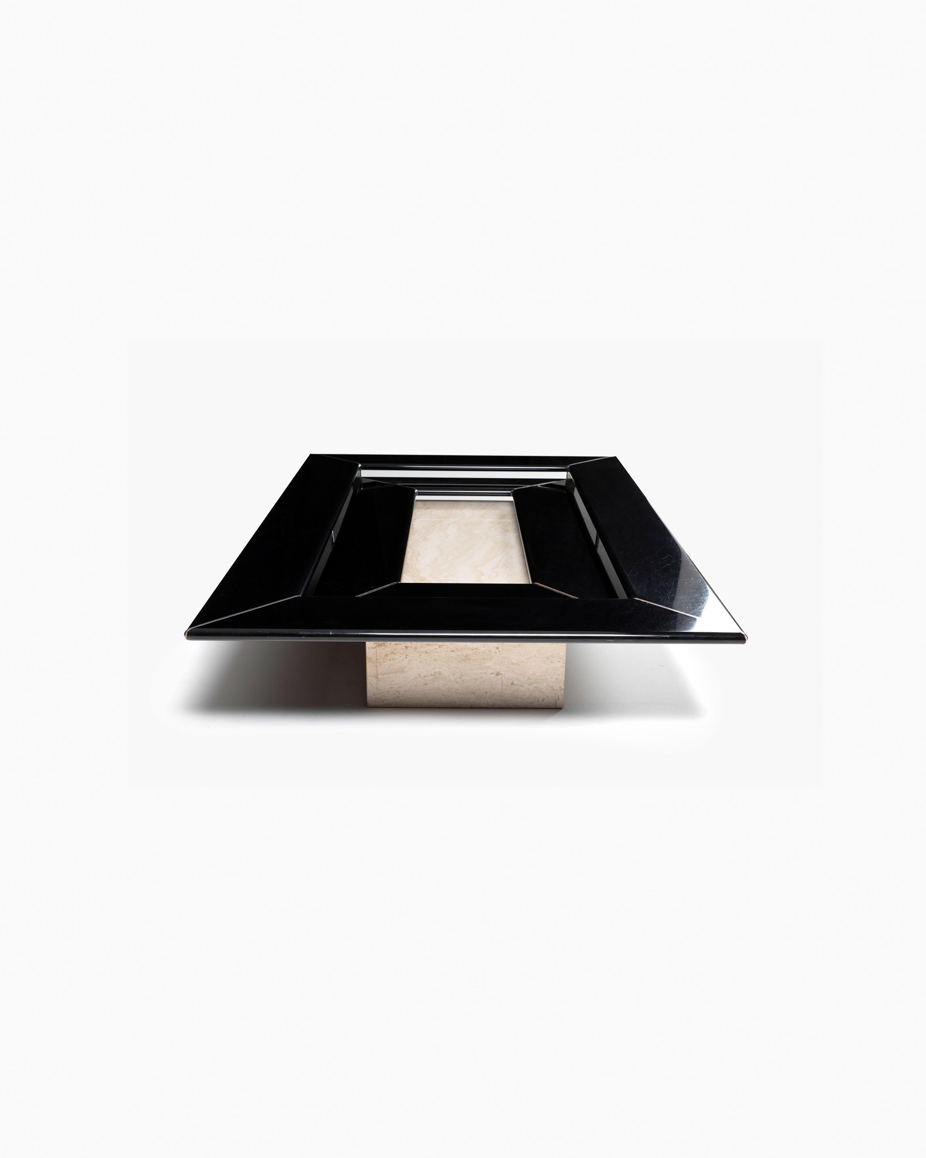 The Re Quatro coffee table is an iconic piece that ushered in the 1980s– a period with a wealth of strong, daring stylistic features, often in dialogue with architecture. The black lacquered top forms two layers of an inverted pyramid as the form
