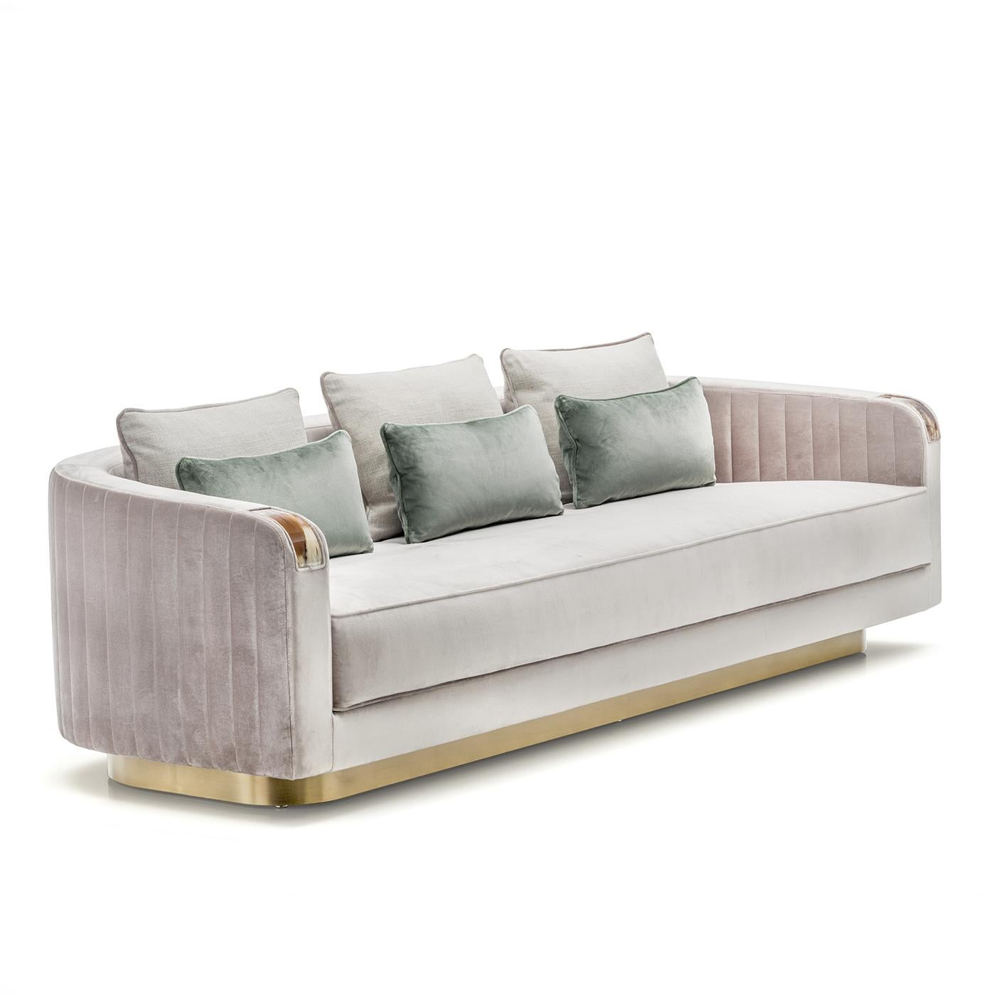 A superb object of functional decor, this sofa will imbue a living room with modern sophistication, while also being a comfortable three-seater. Upholstered in Splendido velvet, with vertical tufting on the enveloping back and armrests, this