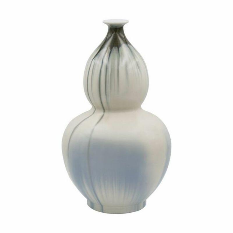 Reaction glazed Porcelain gourd vase - 2 Sizes 

The special antique process makes it looks like a piece of art from a museum. 
High fire porcelain, 100% hand shaped, hand painted. Distress, chips and other imperfections create great characters