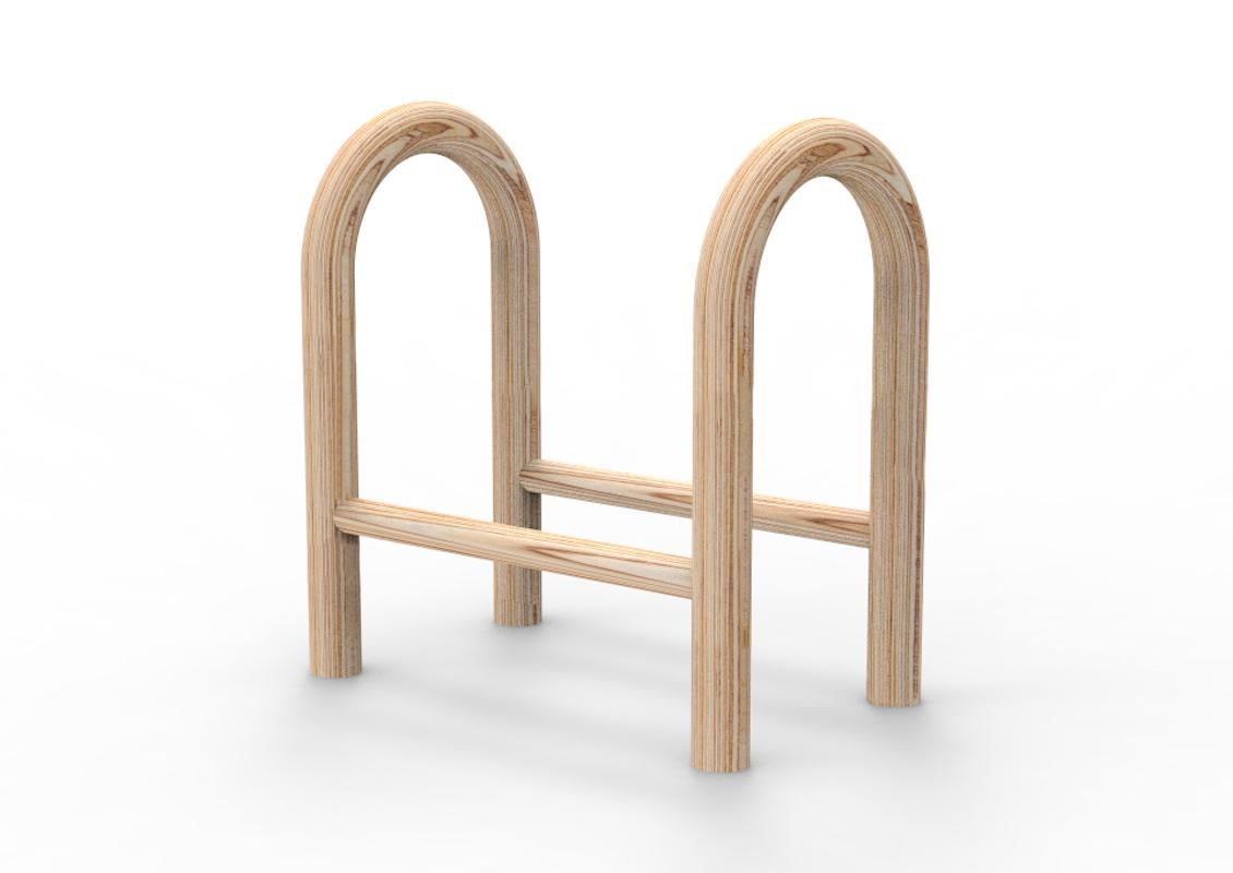 Icelandic designer Katrín Ólína has collaborated with made by Choice to create home products that celebrate reading. Small Reading Horse is a small portable Bookshelf. It is a simple construction of two 35mm bent laminated plywood tubes held