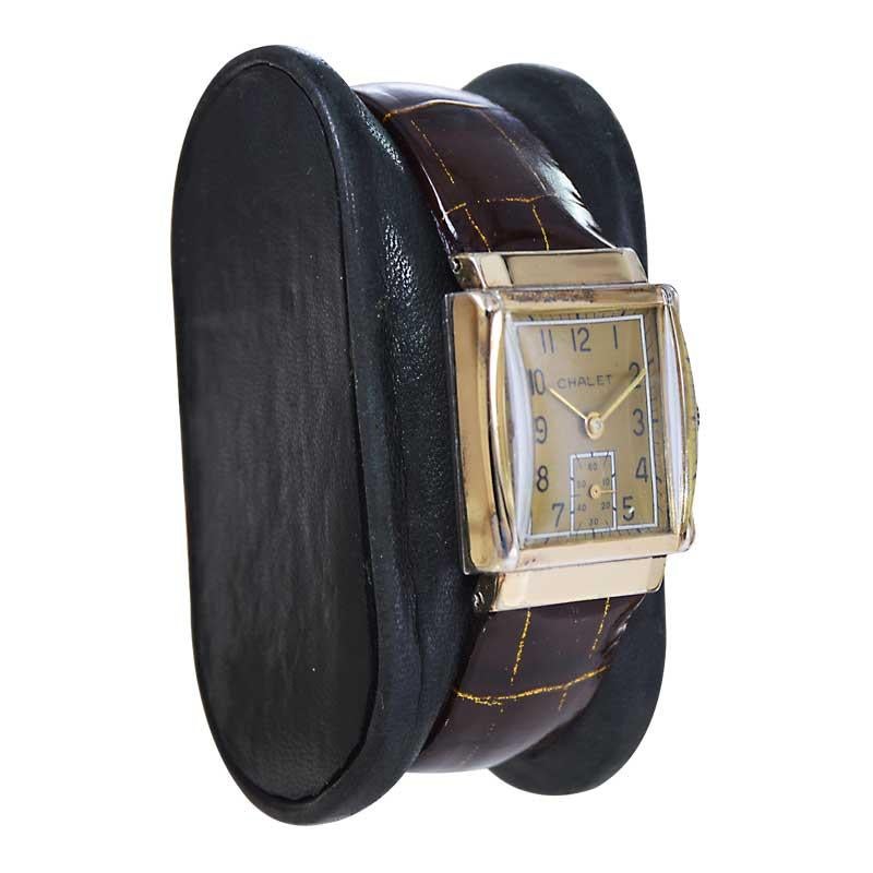 FACTORY / HOUSE: Chalet Watch Company
STYLE / REFERENCE: Art Deco Tank 
METAL / MATERIAL: Yellow Gold Filled 
CIRCA / YEAR: 1940's
DIMENSIONS / SIZE: Length 34mm X Width 22mm
MOVEMENT / CALIBER: Manual Winding / 17 Jewels 
DIAL / HANDS: Original