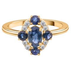 Real 1.25 Carat Blue Sapphire 0.11 Carat SI/H Diamond Ring 14 Karat Yellow Gold