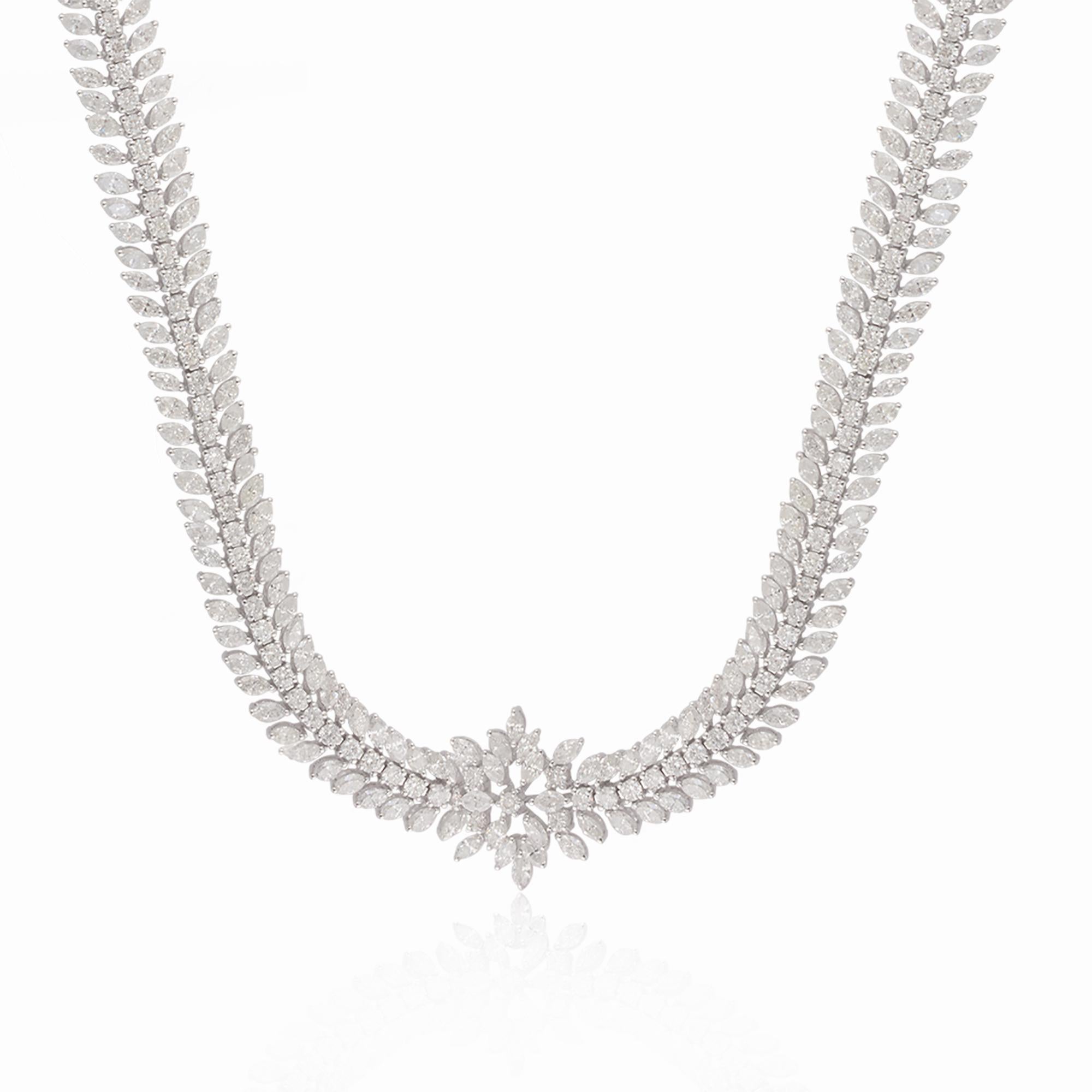 Ce superbe collier présente une combinaison de diamants marquises et ronds, totalisant 12,50 carats, sertis dans un or blanc exquis de 18 carats. Les diamants marquise, avec leur forme élégante et allongée, créent un sentiment de sophistication,