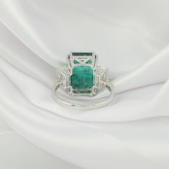 Exceptional 6.79-Carat Emerald-Cut Emerald and Diamond Three-Stone Ring