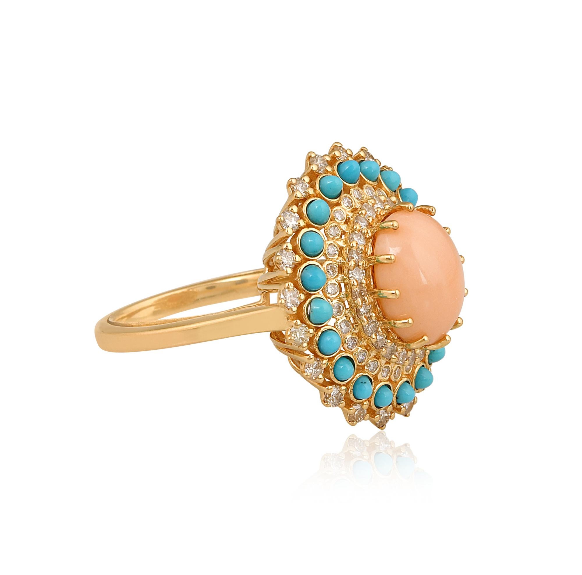 Cast from 14-karat gold, these exquisite ring is handset with 2.63 carats coral,  0.62 carat turquoise and 0.80 carats of sparkling diamonds.

The ring is a size 7 and may be resized to larger or smaller upon request. FOLLOW SPECTRUM JEWELS