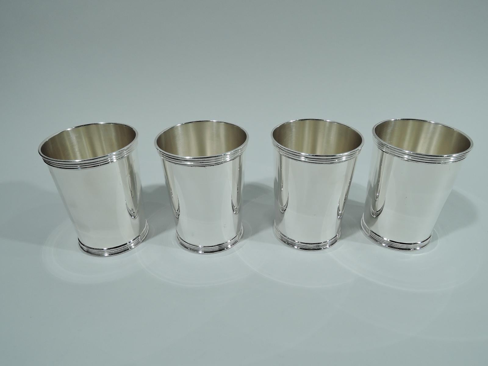 Set of 4 sterling silver mint julep cups. Each: Straight and tapering sides, and reeded rim and foot. A great way to celebrate Derby day with a few close friends. Marked “Sterling / Trees”. Benjamin Trees was active in Lexington, Kentucky from the