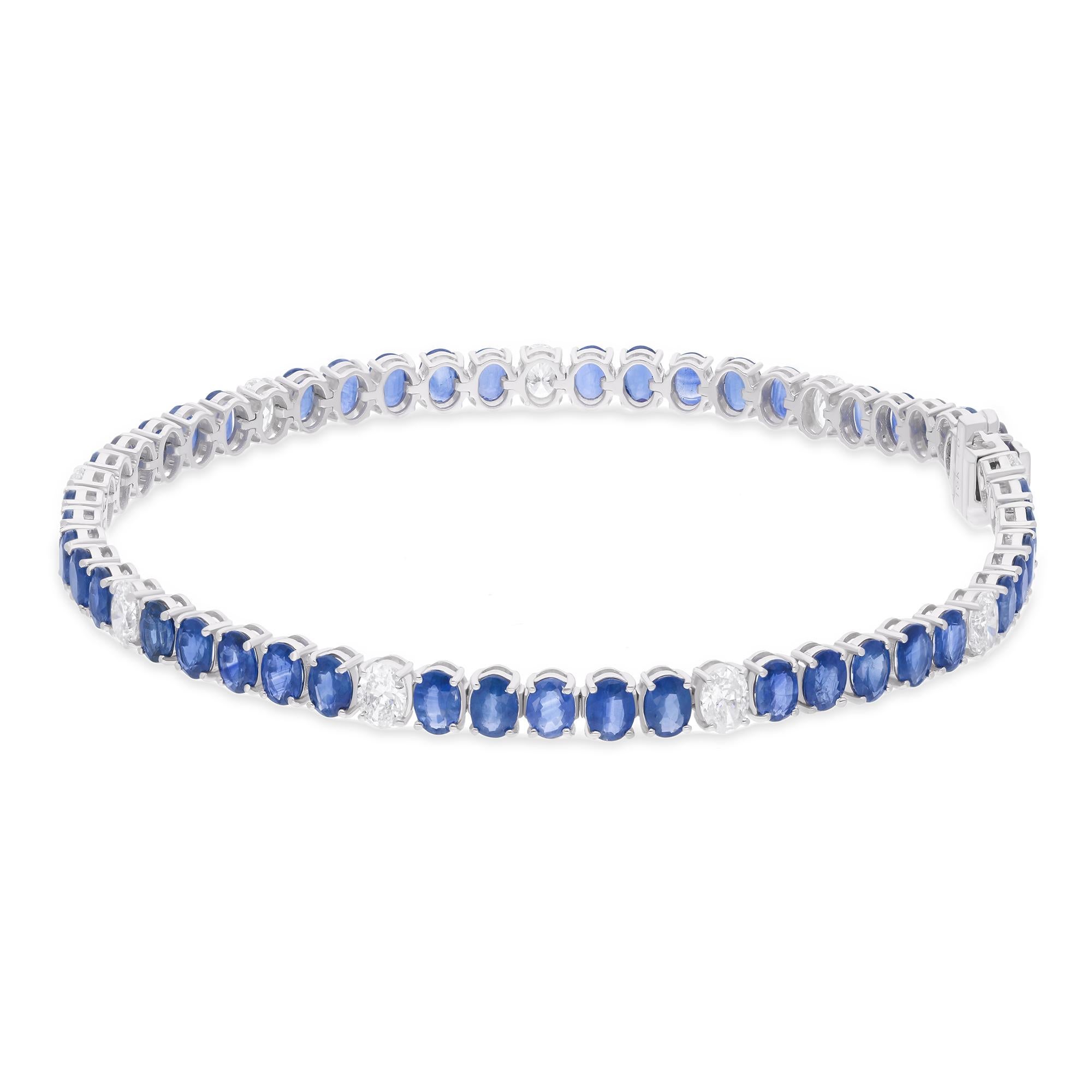 Surrounding the sapphires are sparkling diamonds, adding a touch of brilliance and sophistication to the design. These diamonds are of the highest quality, expertly cut and set to maximize their fire and scintillation, creating a dazzling display of