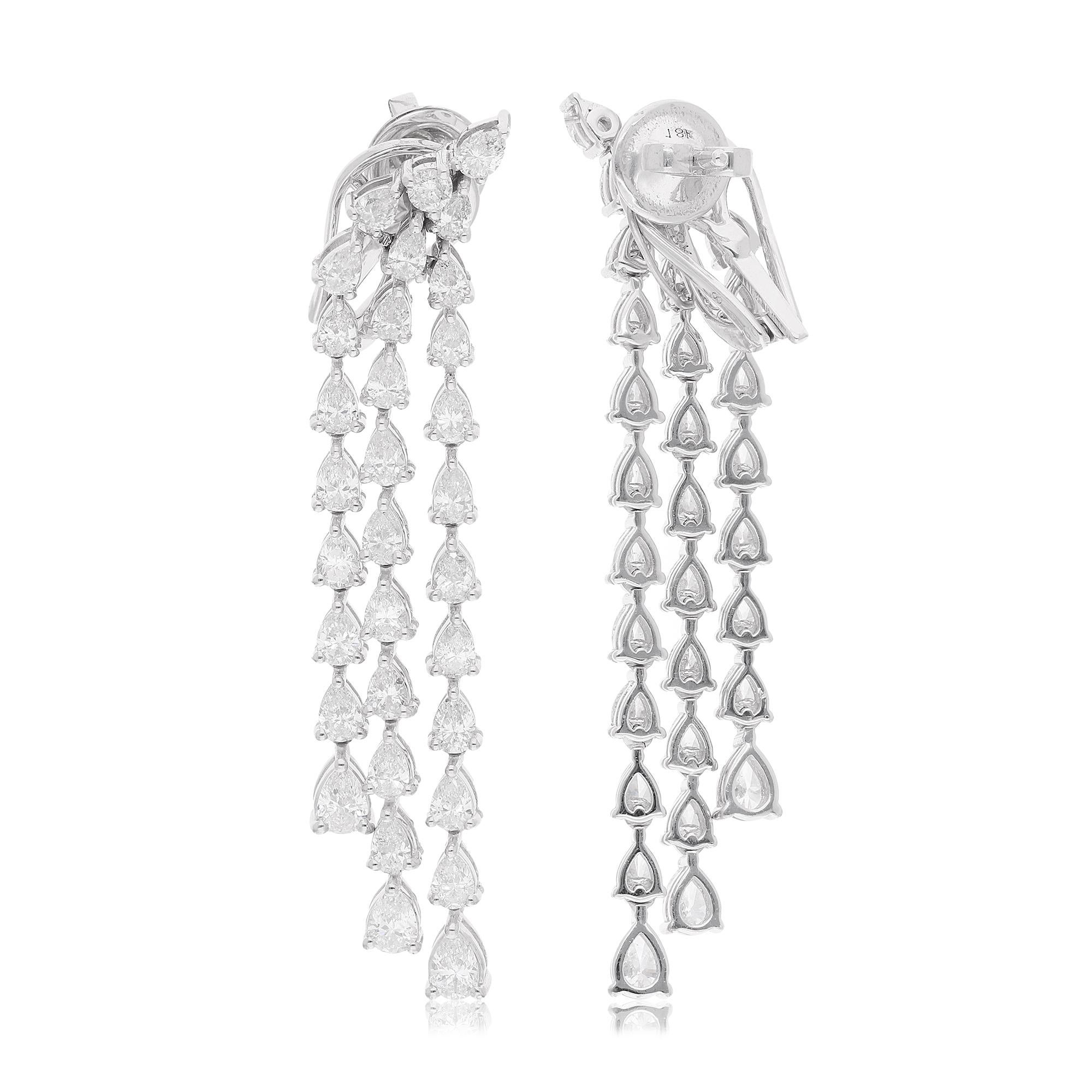 Step into the world of refined elegance with these exquisite Pear & Round Diamond Dangle Earrings, meticulously handcrafted in solid 14 karat white gold. These stunning earrings are a true testament to artisanal craftsmanship, featuring a