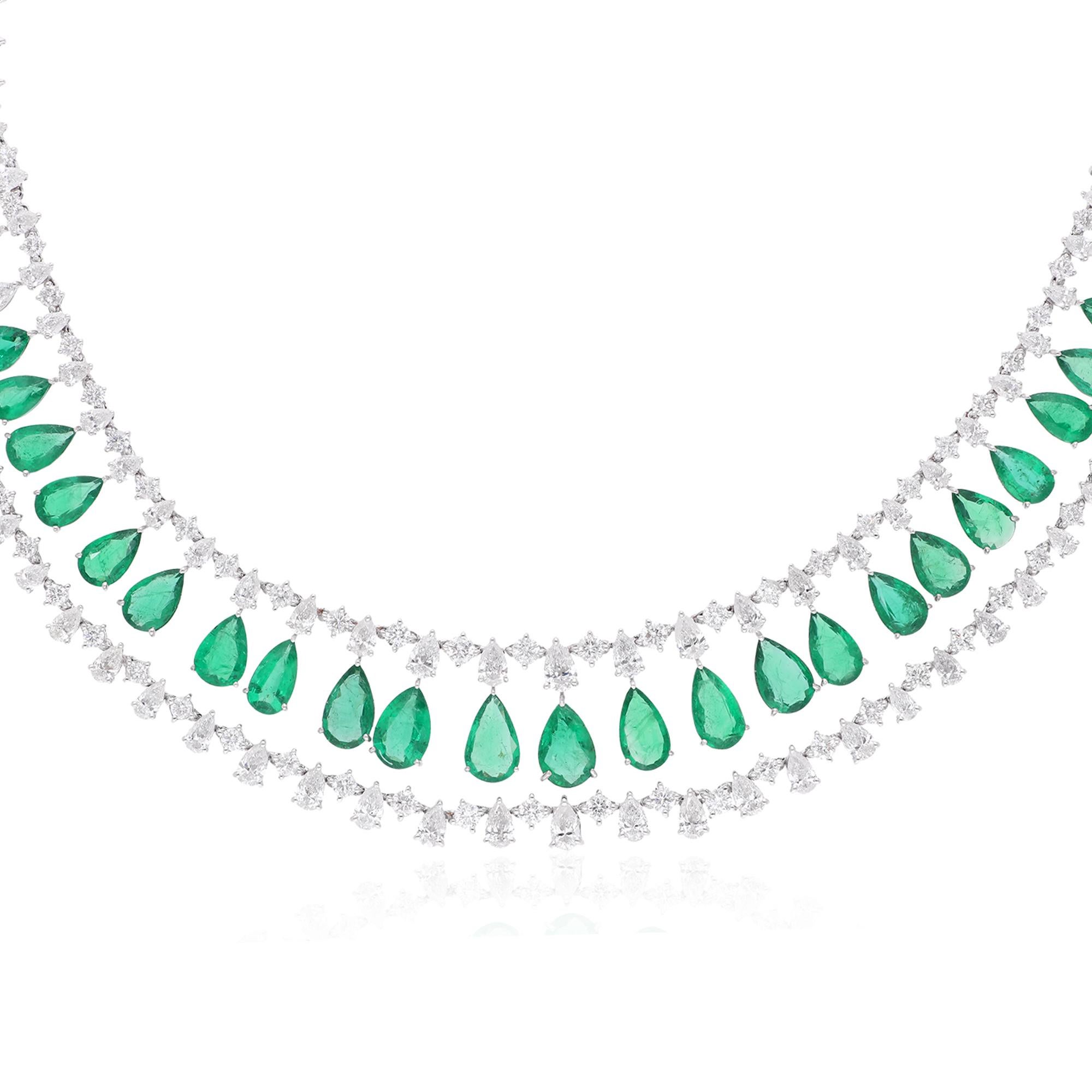 Adorn yourself in the unparalleled splendor of this exquisite Pear Zambian Emerald Gemstone Necklace, embellished with radiant diamonds and meticulously crafted in 14 karat white gold. This stunning piece of fine jewelry is a fusion of timeless