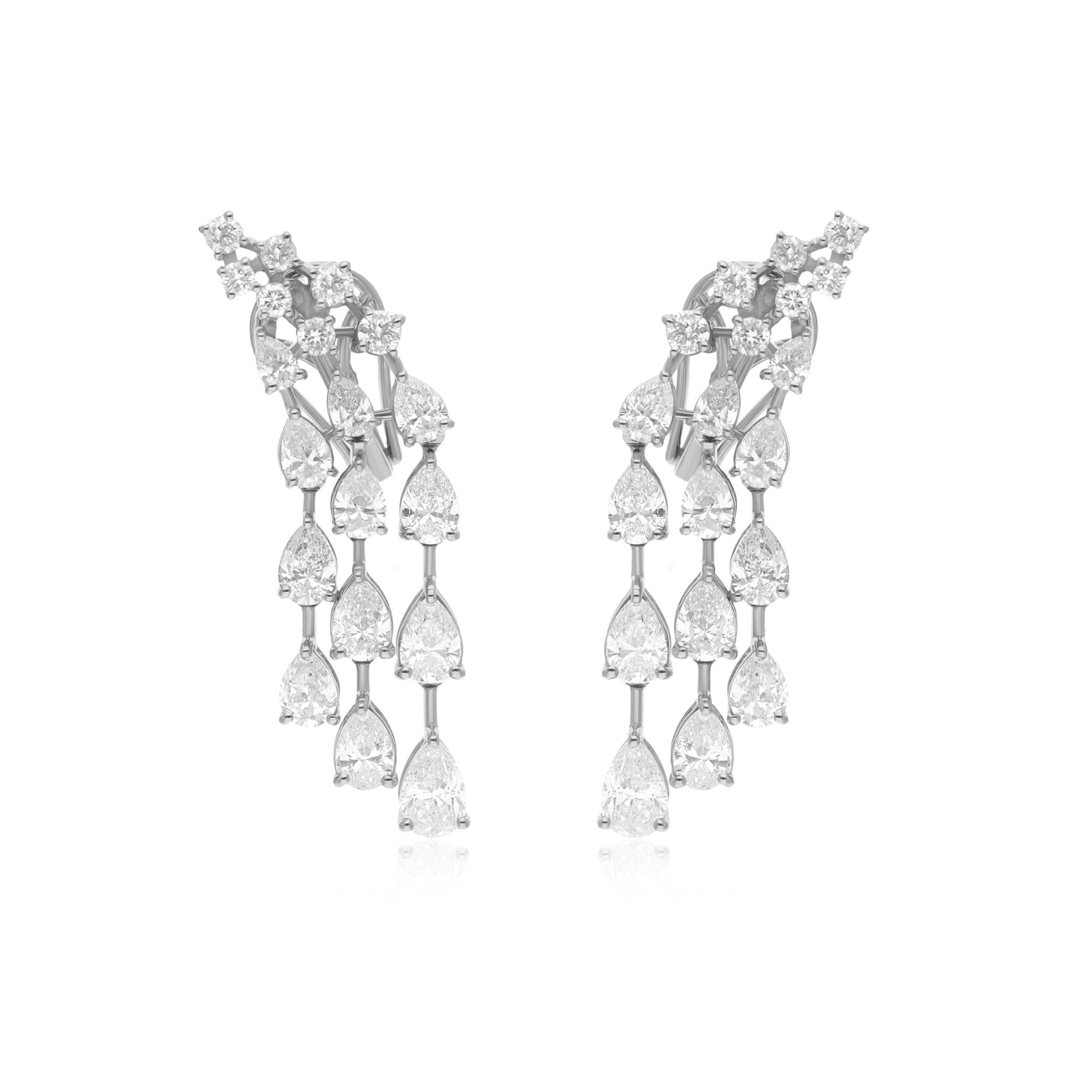 Immerse yourself in the allure of timeless sophistication with these Real Round & Pear Diamond Dangle Earrings, meticulously crafted by hand in luxurious 18 Karat White Gold. Each earring is a masterpiece of artisanal skill and exquisite design,