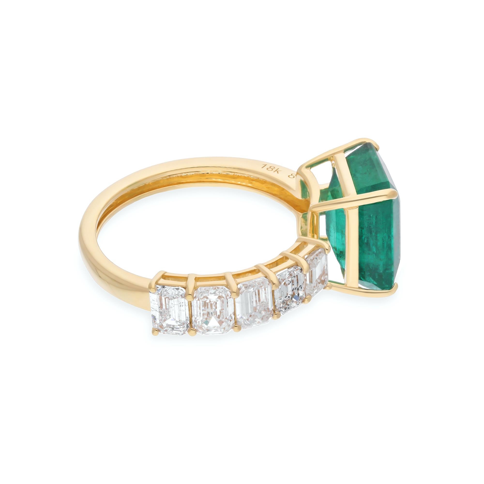 This luxurious cuff ring features a breathtaking 4.26-carat Zambian emerald, set in 18 karat yellow gold. Adorned with 1.18 carats of natural diamonds, with an average clarity of SI1-SI2 and a color grade of H-I, this ring radiates elegance and