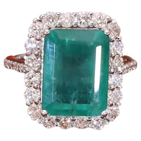 Handcrafted with care and precision, this ring features a stunning 7.42 ct. Emerald Cut Zambian Emerald at its center, surrounded by halo of sparkling diamonds. This ring is available in 18k Rose Gold/White Gold/Yellow Gold.

This is a perfect Gift
