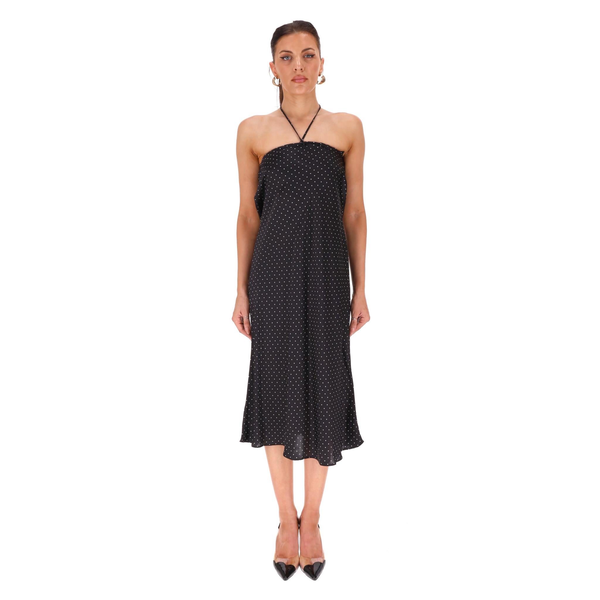 Realisation x Claudia Schiffer Polka-Dot Silk Dress

Black slip dress fully crafted from silk and designed with all-over polka-dot print in white.

Featuring flared midi skirt and thin halter neck tie detail.

Rrp Approx. £230

Size – XS

Condition